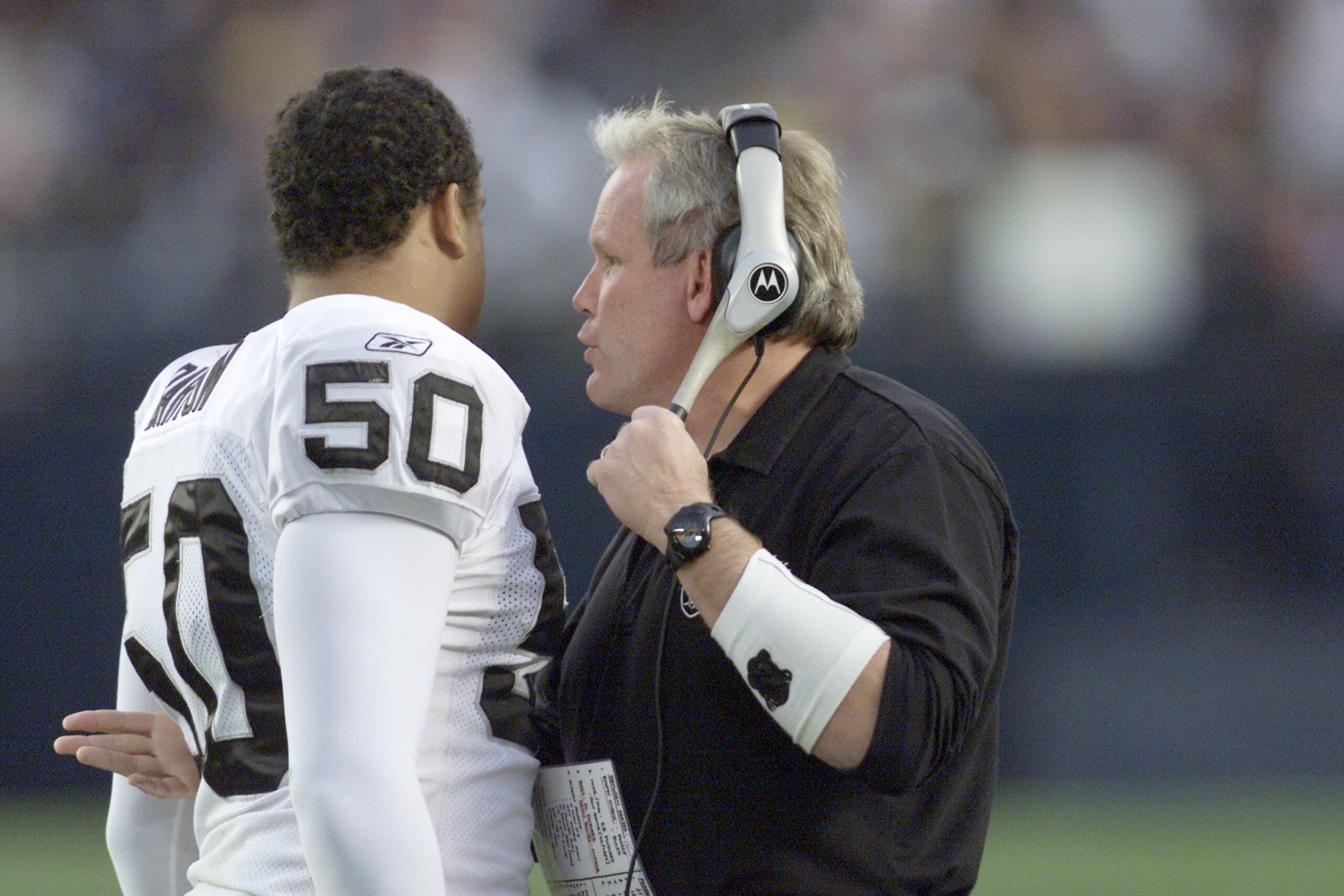 15 Dec 2001: Chuck Bresnahan defensive coordinator for the Oakland Raiders talks with linebacker Eric Barton #50 during their game at Qualcomm Stadium in San Diego, California. The Raiders won 13-6. DIGITAL IMAGE Mandatory Credit: Stephen Dunn/ALLS 15 Dec 2001: Chuck Bresnahan defensive coordinator for the Oakland Raiders talks with linebacker Eric Barton #50 during their game at Qualcomm Stadium in San Diego, California. The Raiders won 13-6. DIGITAL IMAGE Mandatory Credit: Stephen Dunn/ALLS