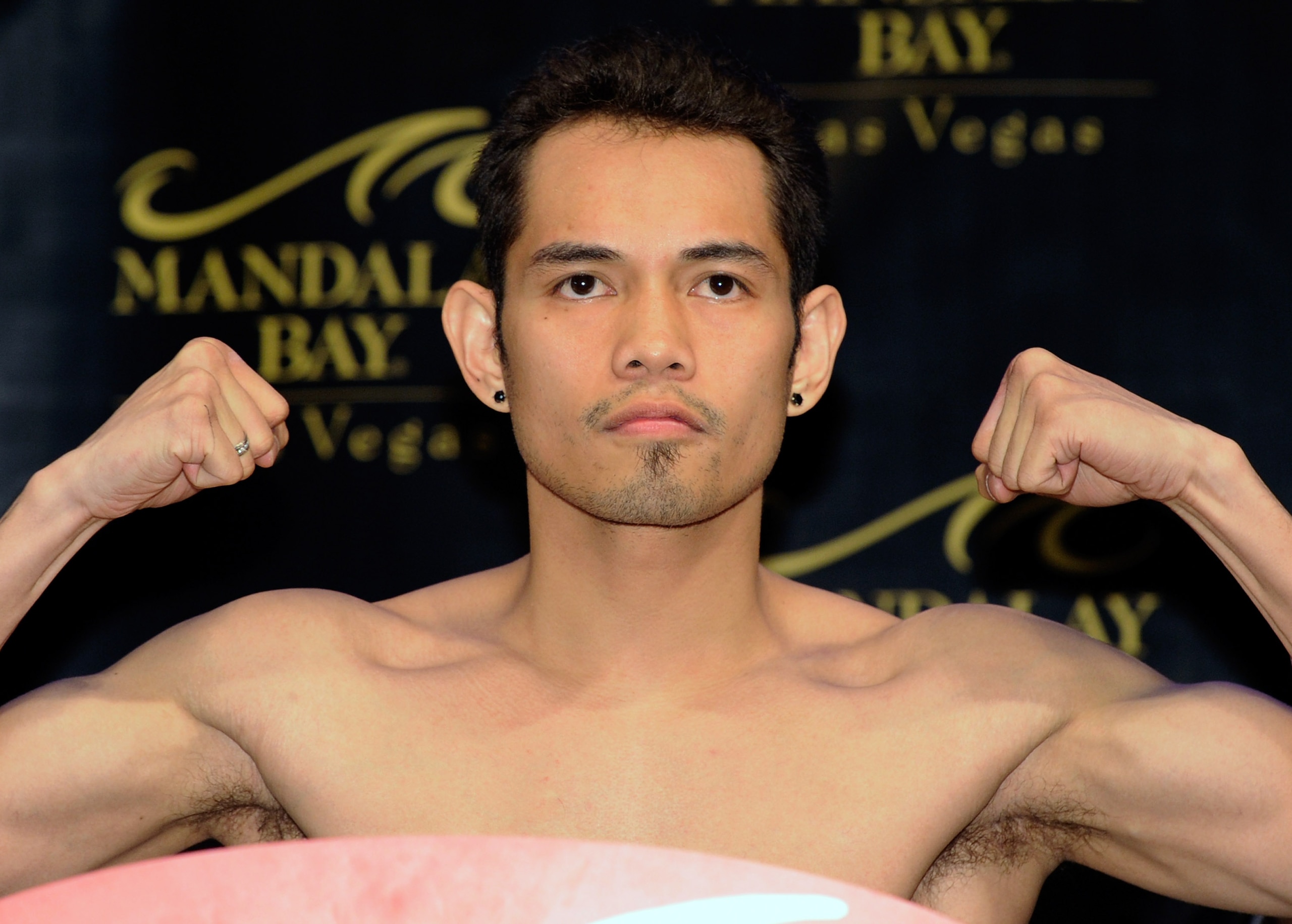 LAS VEGAS, NV - FEBRUARY 18:  Nonito Donaire of the Philippines poses on a scale during the official weigh-in for his fight against WBC/WBO bantamweight champion Fernando Montiel of Mexico at the Mandalay Bay Resort & Casino February 18, 2011 in Las Vegas