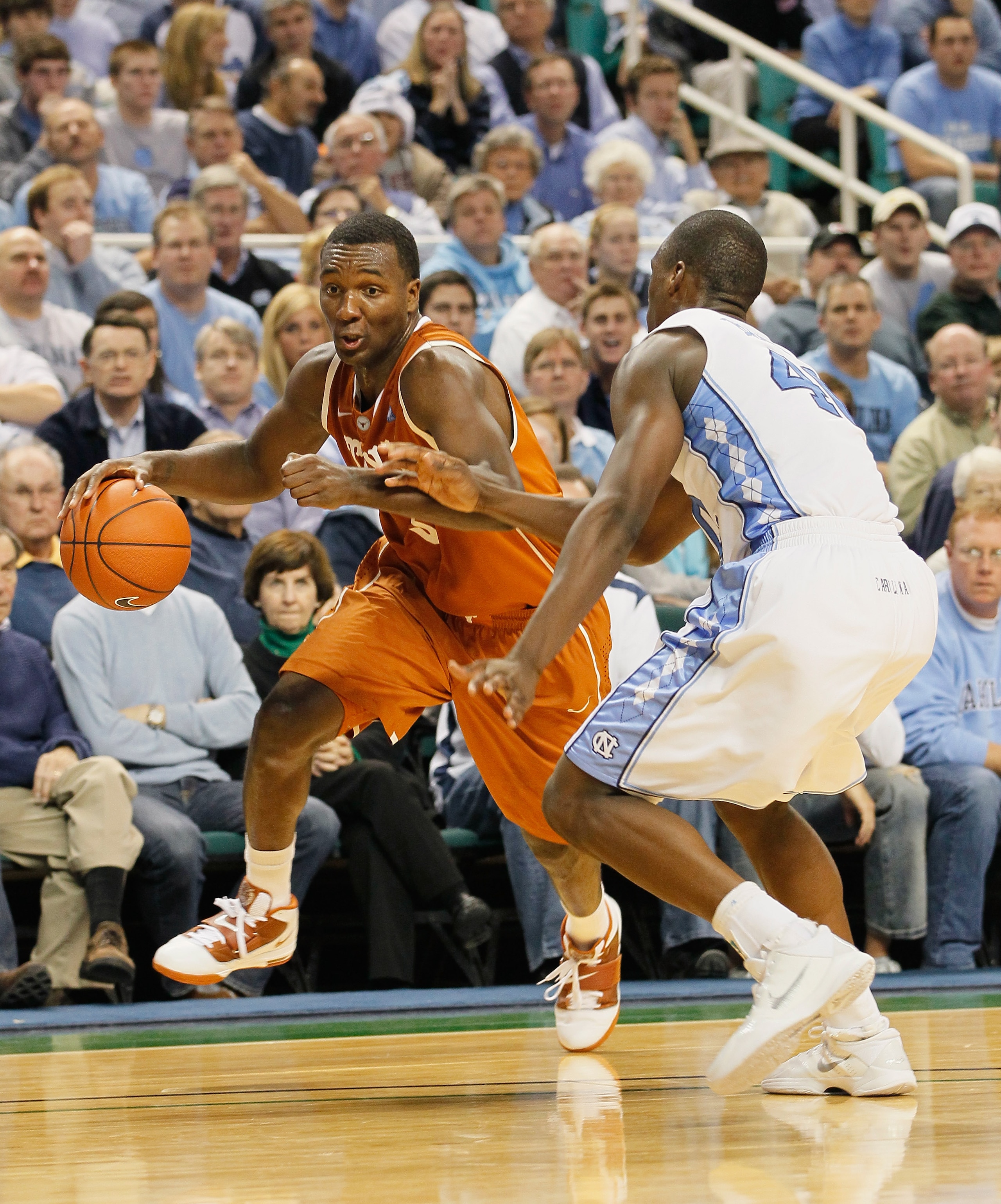GREENSBORO, NC - DECEMBER 18:  Jordan Hamilton #3 of the Texas Longhorns against Harrison Barnes #40 of the North Carolina Tar Heels at Greensboro Coliseum on December 18, 2010 in Greensboro, North Carolina.  (Photo by Kevin C. Cox/Getty Images)