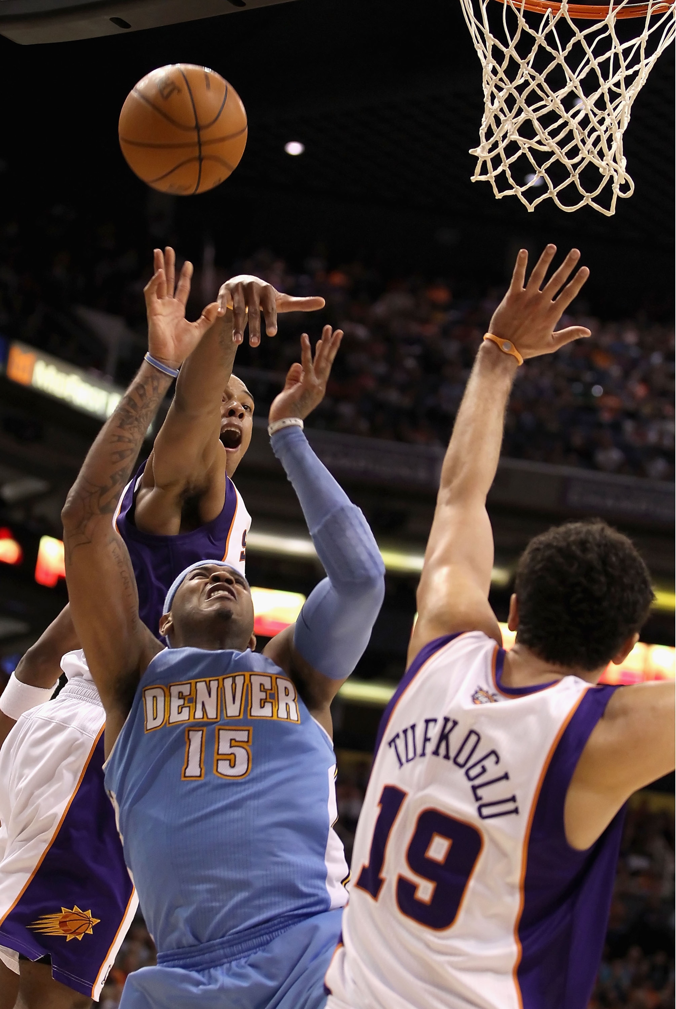 PHOENIX - NOVEMBER 15: Carmelo Anthony #15 of the Denver Nuggets puts up a shot during the NBA game against the Phoenix Suns at US Airways Center on November 15, 2010 in Phoenix, Arizona. The Suns defeated the Nuggets 100-94. NOTE TO USER: User express PHOENIX - NOVEMBER 15: Carmelo Anthony #15 of the Denver Nuggets puts up a shot during the NBA game against the Phoenix Suns at US Airways Center on November 15, 2010 in Phoenix, Arizona. The Suns defeated the Nuggets 100-94. NOTE TO USER: User express