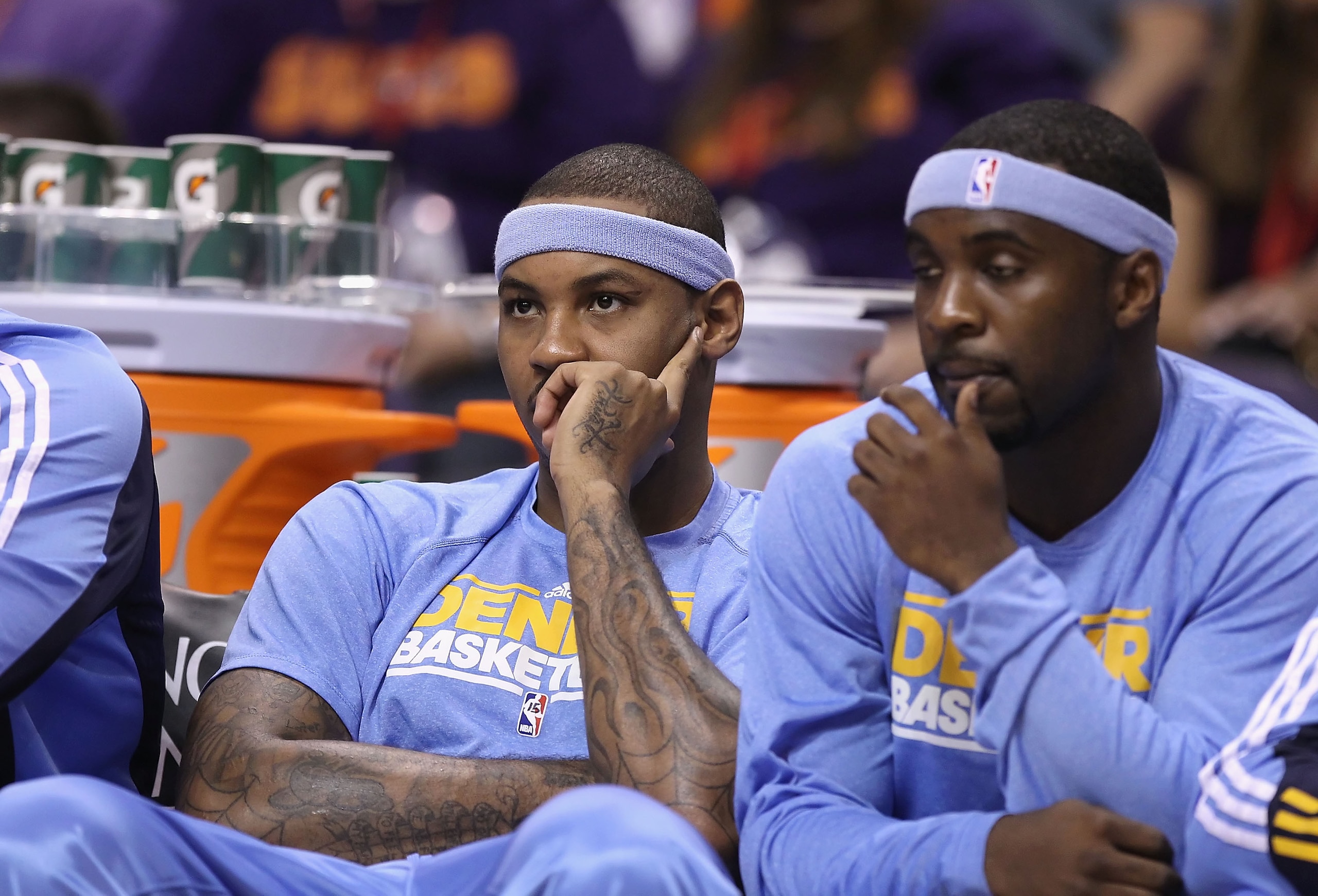 PHOENIX - OCTOBER 22: Carmelo Anthony #15 of the Denver Nuggets watches from the bench during the preseason NBA game against the Phoenix Suns at US Airways Center on October 22, 2010 in Phoenix, Arizona. NOTE TO USER: User expressly acknowledges and agre PHOENIX - OCTOBER 22: Carmelo Anthony #15 of the Denver Nuggets watches from the bench during the preseason NBA game against the Phoenix Suns at US Airways Center on October 22, 2010 in Phoenix, Arizona. NOTE TO USER: User expressly acknowledges and agre
