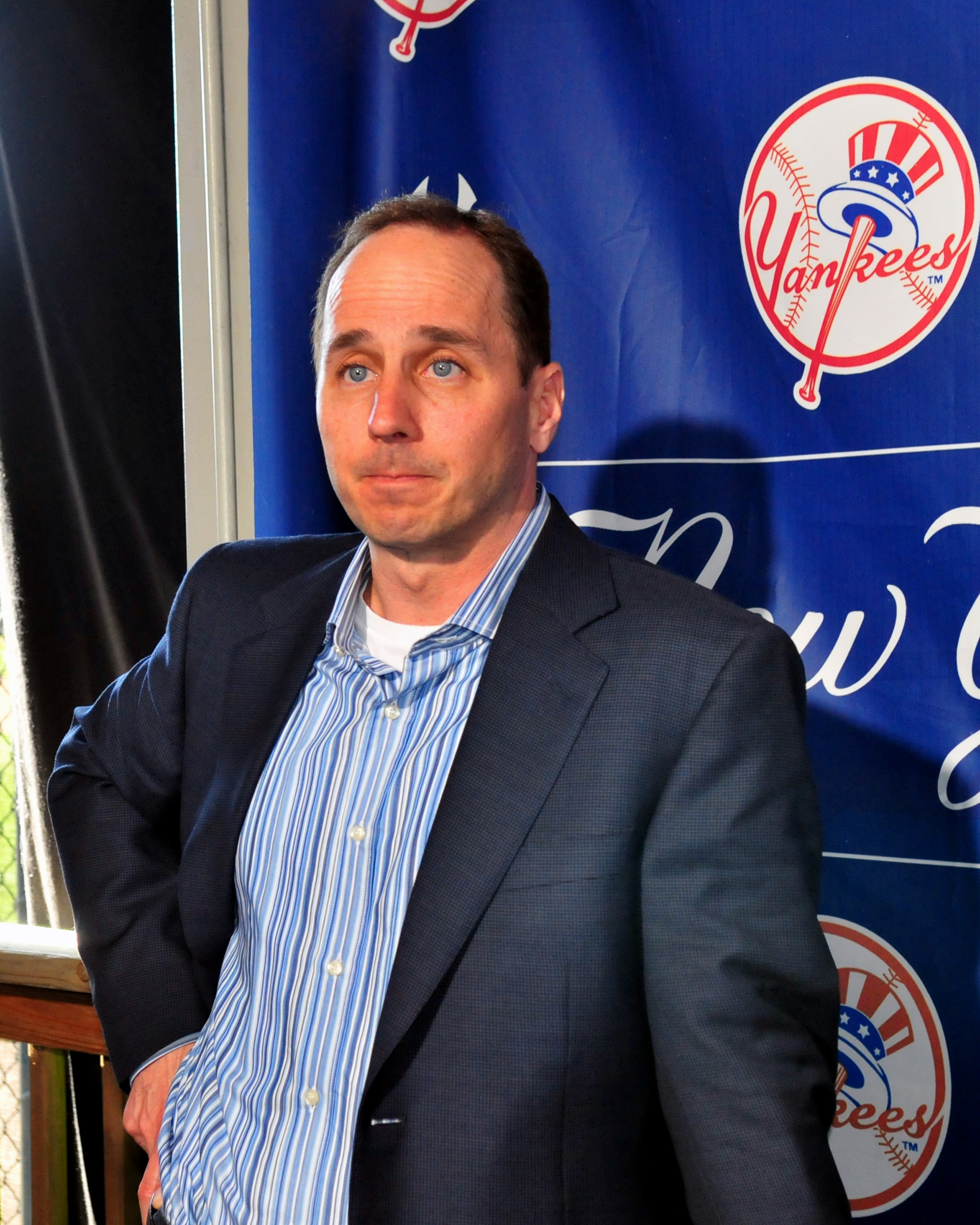 TAMPA - FEBRUARY 17:  General Manager Brian Cashman listens during a press conference with infielder Alex Rodriguez of the New York Yankees February 17, 2008 at the George M. Steinbrenner Field in Tampa, Florida. The Yankees third baseman admitted to taki