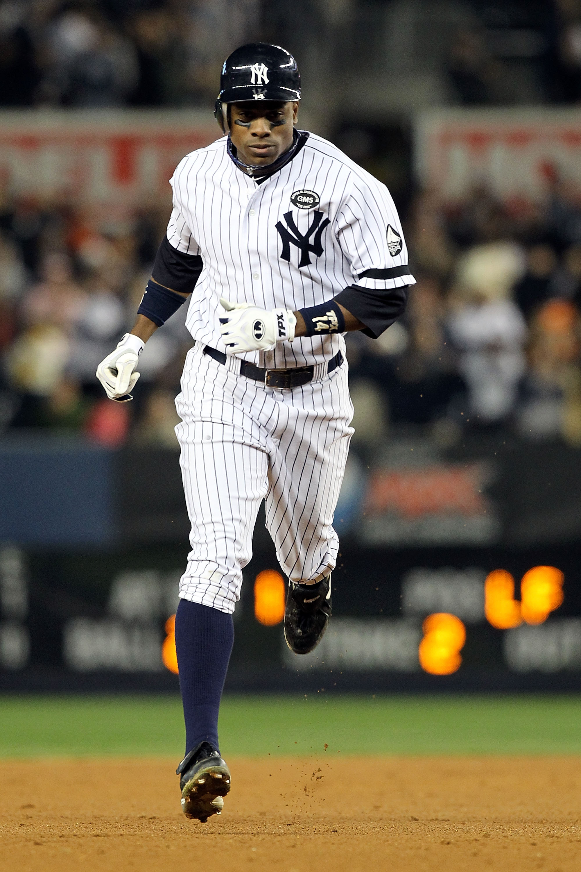 NEW YORK - OCTOBER 20:  Curtis Granderson #14 of the New York Yankees runs the bases on his solo home run in the bottom of the eighth inning against the Texas Rangers in Game Five of the ALCS during the 2010 MLB Playoffs at Yankee Stadium on October 20, 2