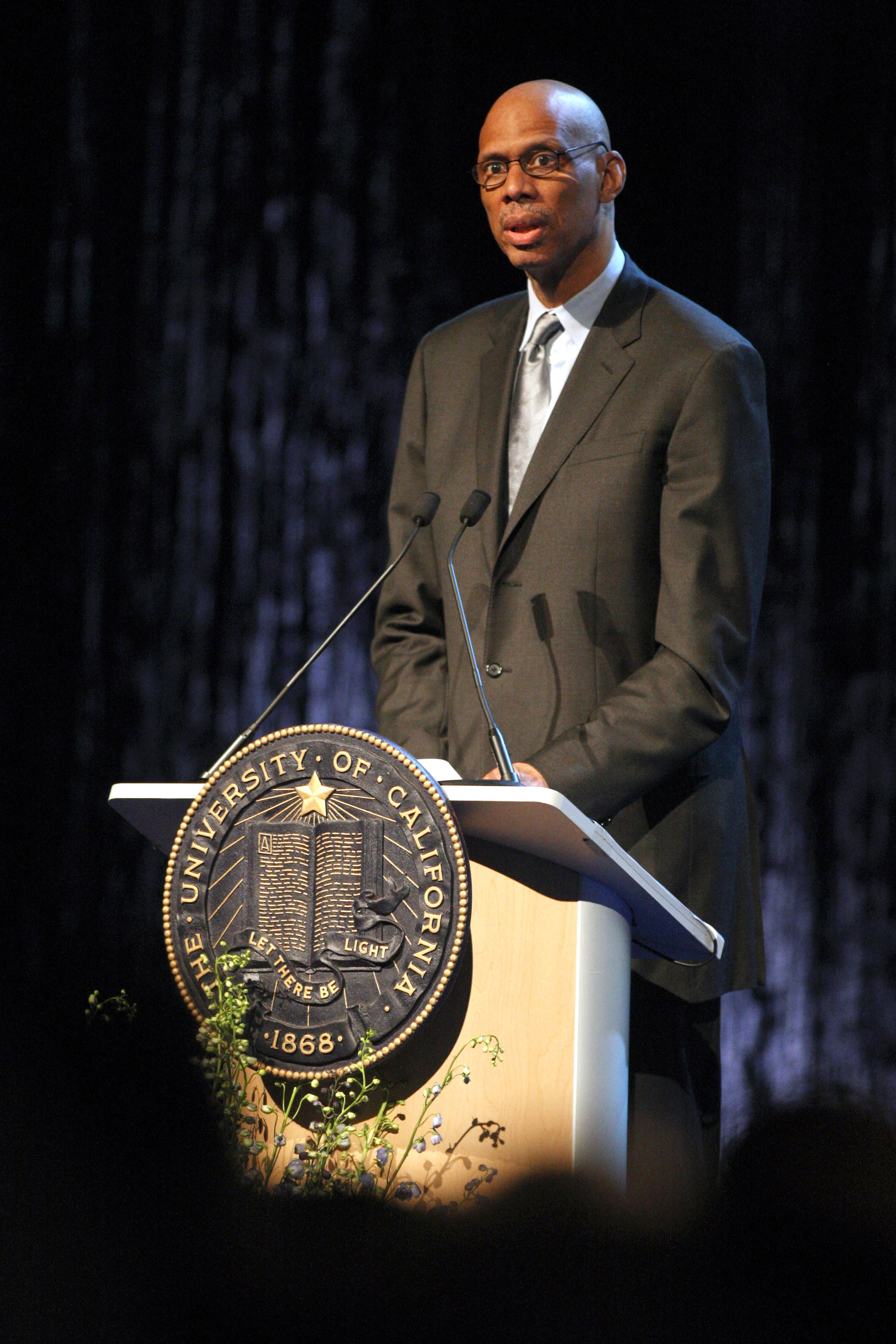 WESTWOOD, CA - JUNE 26, 2010: Former UCLA and NBA player Kareem Abdul Jabbar delivers remarks during the memorial service for former UCLA basketball coach John Wooden on June 26, 2010 at Pauley Pavilion on the University of California Los Angeles campus WESTWOOD, CA - JUNE 26, 2010: Former UCLA and NBA player Kareem Abdul Jabbar delivers remarks during the memorial service for former UCLA basketball coach John Wooden on June 26, 2010 at Pauley Pavilion on the University of California Los Angeles campus