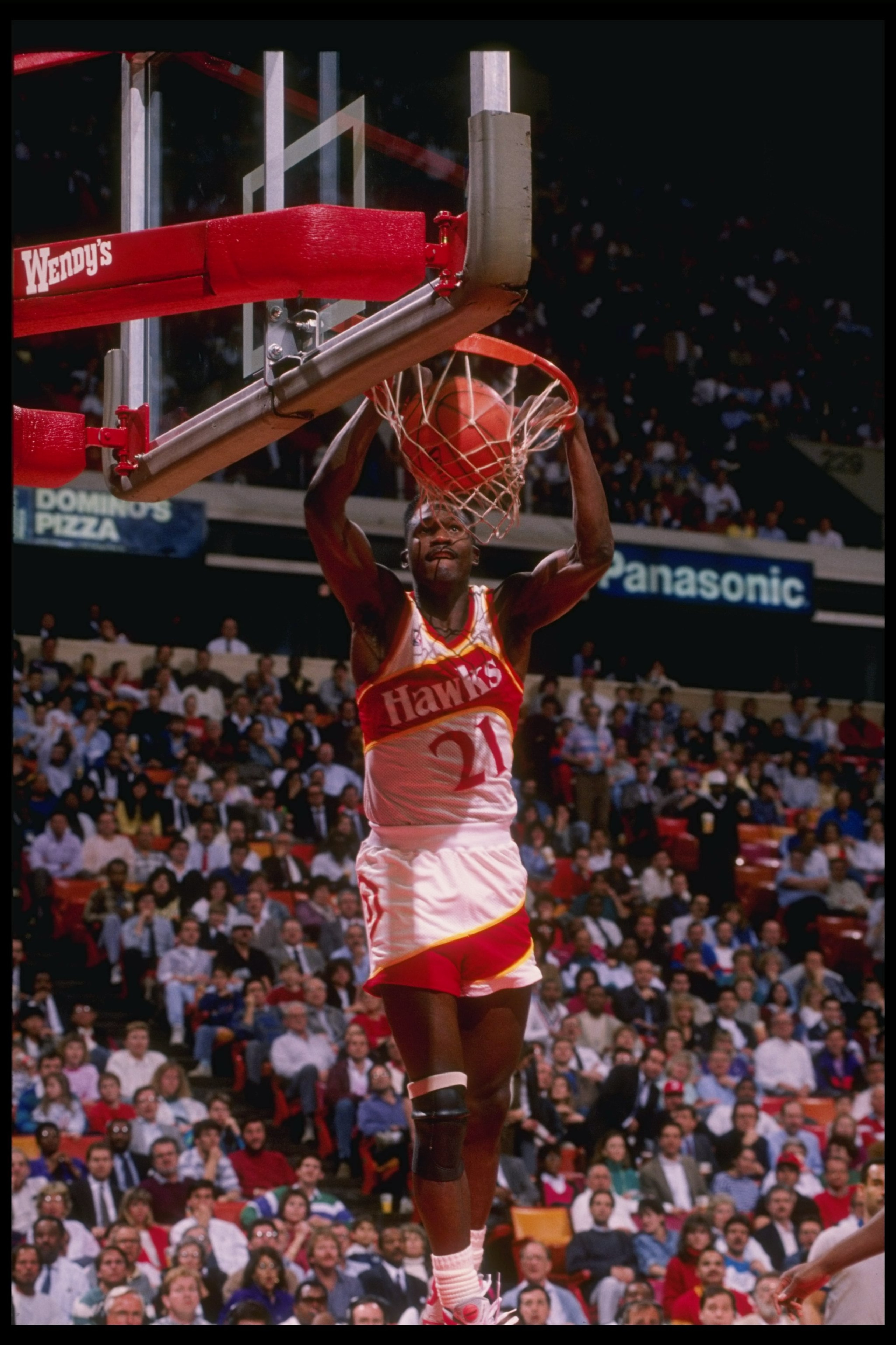 Forward Dominique Wilkins of the Atlanta Hawks slam dunks the ball during a game at the Omni in Atlanta, Georgia. Forward Dominique Wilkins of the Atlanta Hawks slam dunks the ball during a game at the Omni in Atlanta, Georgia.