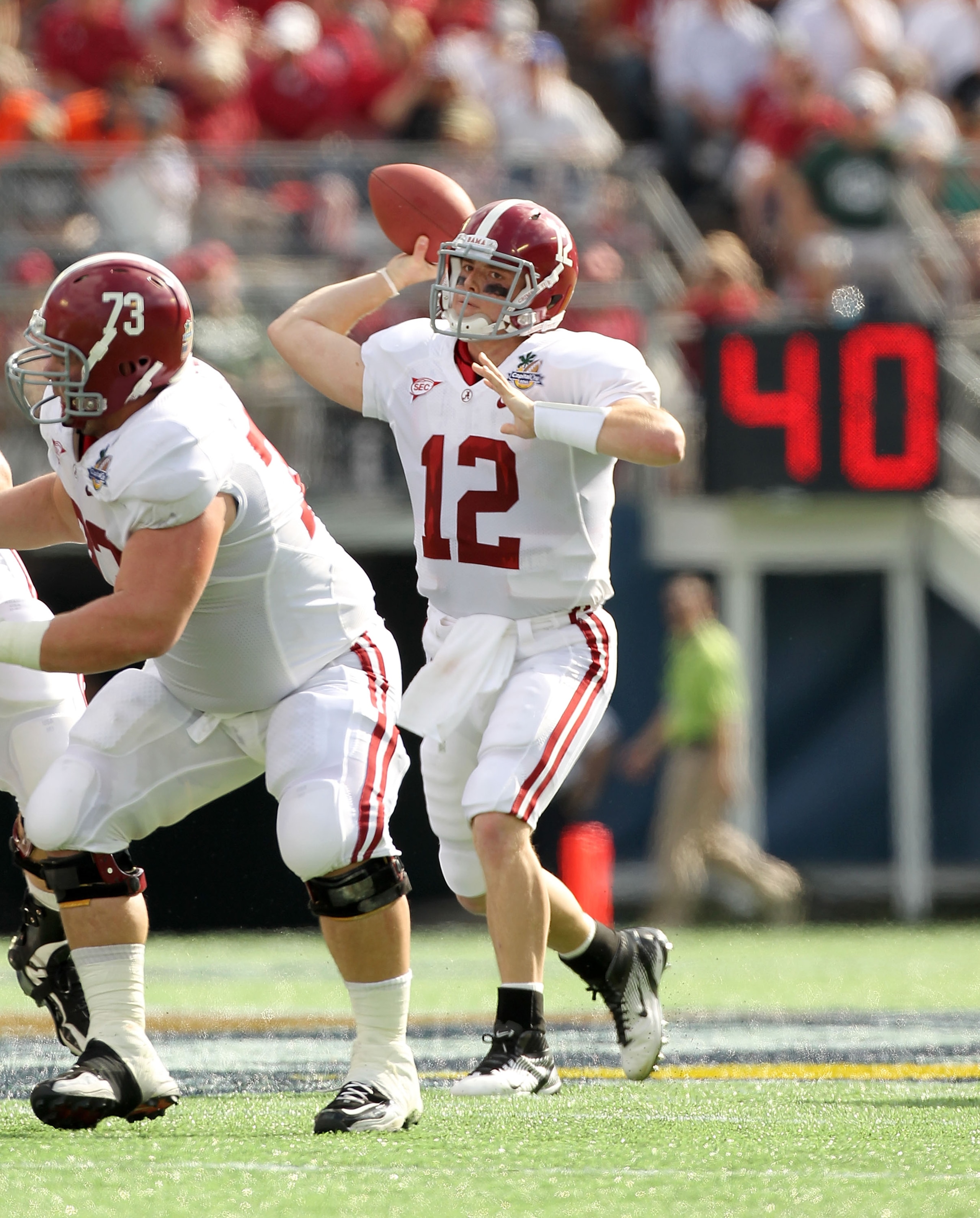 ORLANDO, FL - JANUARY 01: Greg McElroy #12 of the Alabama Crimson Tide passes the ball during the Capitol One Bowl against the Michigan State Spartans at the Florida Citrus Bowl on January 1, 2011 in Orlando, Florida. (Photo by Mike Ehrmann/Getty Images ORLANDO, FL - JANUARY 01: Greg McElroy #12 of the Alabama Crimson Tide passes the ball during the Capitol One Bowl against the Michigan State Spartans at the Florida Citrus Bowl on January 1, 2011 in Orlando, Florida. (Photo by Mike Ehrmann/Getty Images