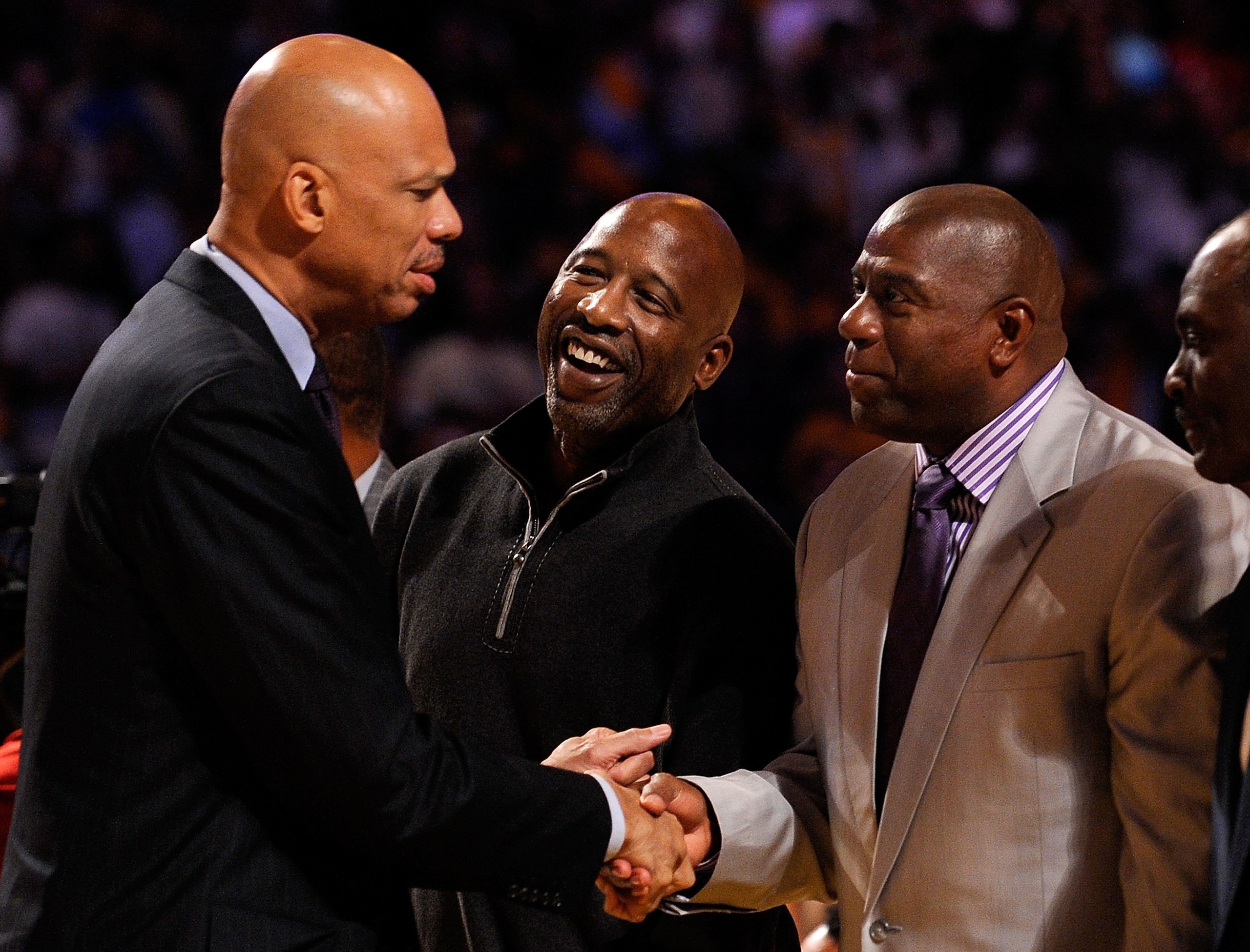 LOS ANGELES, CA - OCTOBER 27: (L-R) Assistant coach Kareem Abdul-Jabbar (L) of the Los Angeles Lakers is congratulated by former Laker champions James Worthy and Magic Johnson after receiving his 2009 NBA Championship ring before the season opening game LOS ANGELES, CA - OCTOBER 27: (L-R) Assistant coach Kareem Abdul-Jabbar (L) of the Los Angeles Lakers is congratulated by former Laker champions James Worthy and Magic Johnson after receiving his 2009 NBA Championship ring before the season opening game