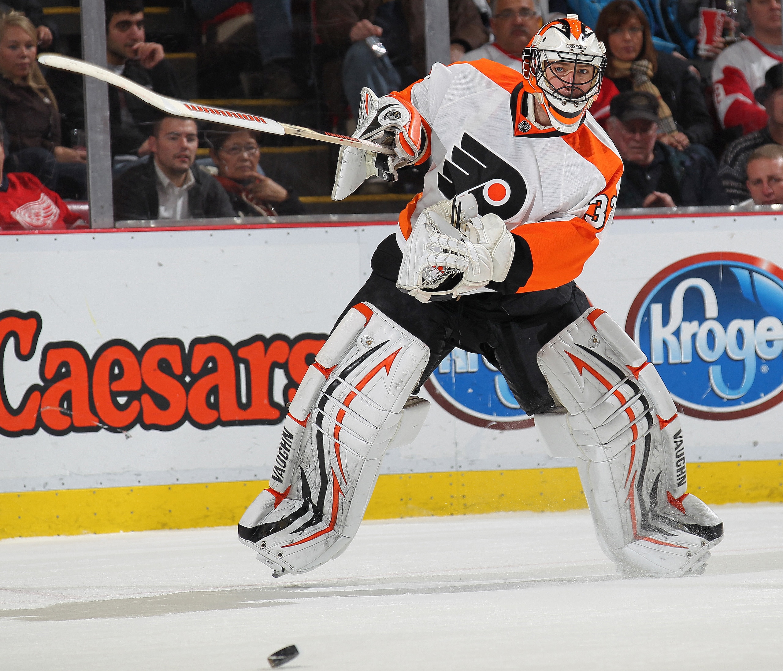 DETROIT, MI - JANUARY 2:  Brian Boucher #33 of the Philadelphia Flyers clears the puck out of harms way in a game against the Detroit Red Wings on January 2, 2011 at the Joe Louis Arena in Detroit, Michigan. The Flyers defeated the Wings 3-2. (Photo by Cl