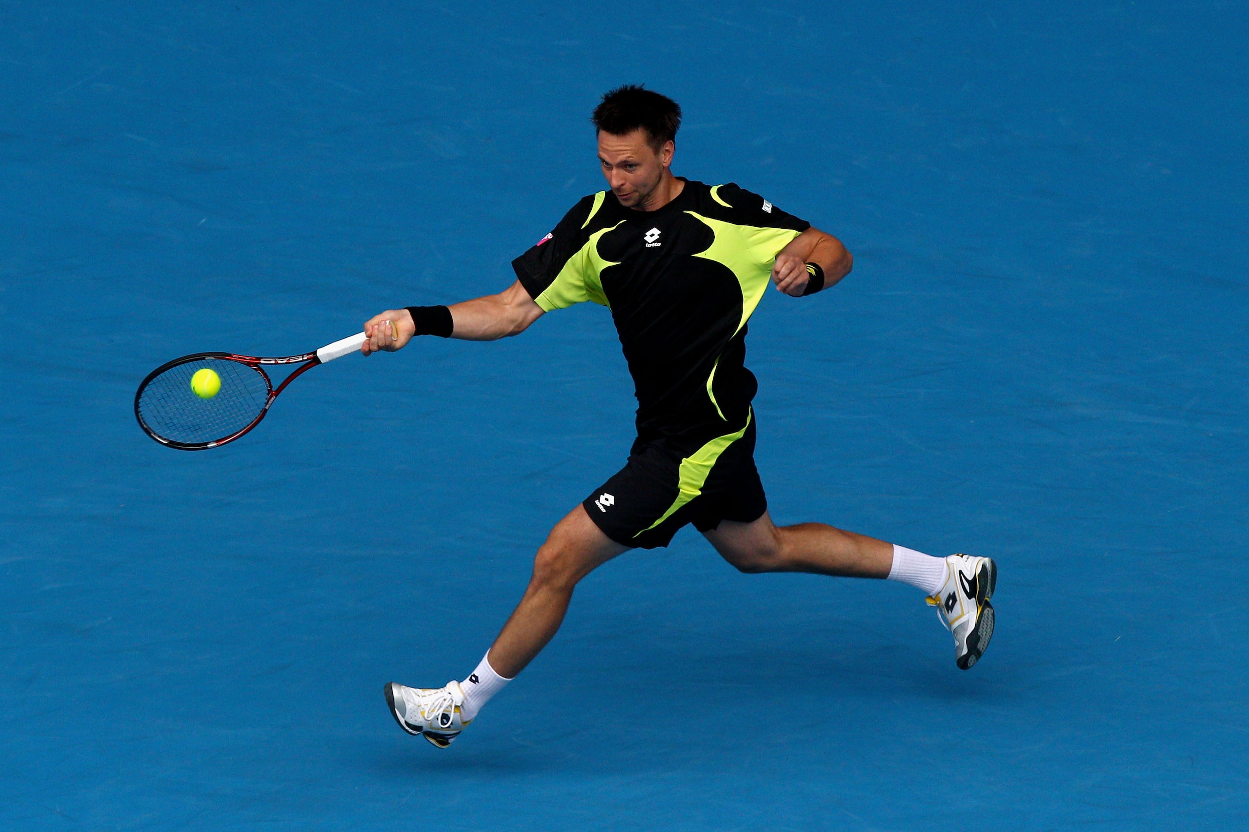 MELBOURNE, AUSTRALIA - JANUARY 24:  Robin Soderling of Sweden plays a forehand in his fourth round match against Alexandr Dolgopolov of the Ukraine during day eight of the 2011 Australian Open at Melbourne Park on January 24, 2011 in Melbourne, Australia.
