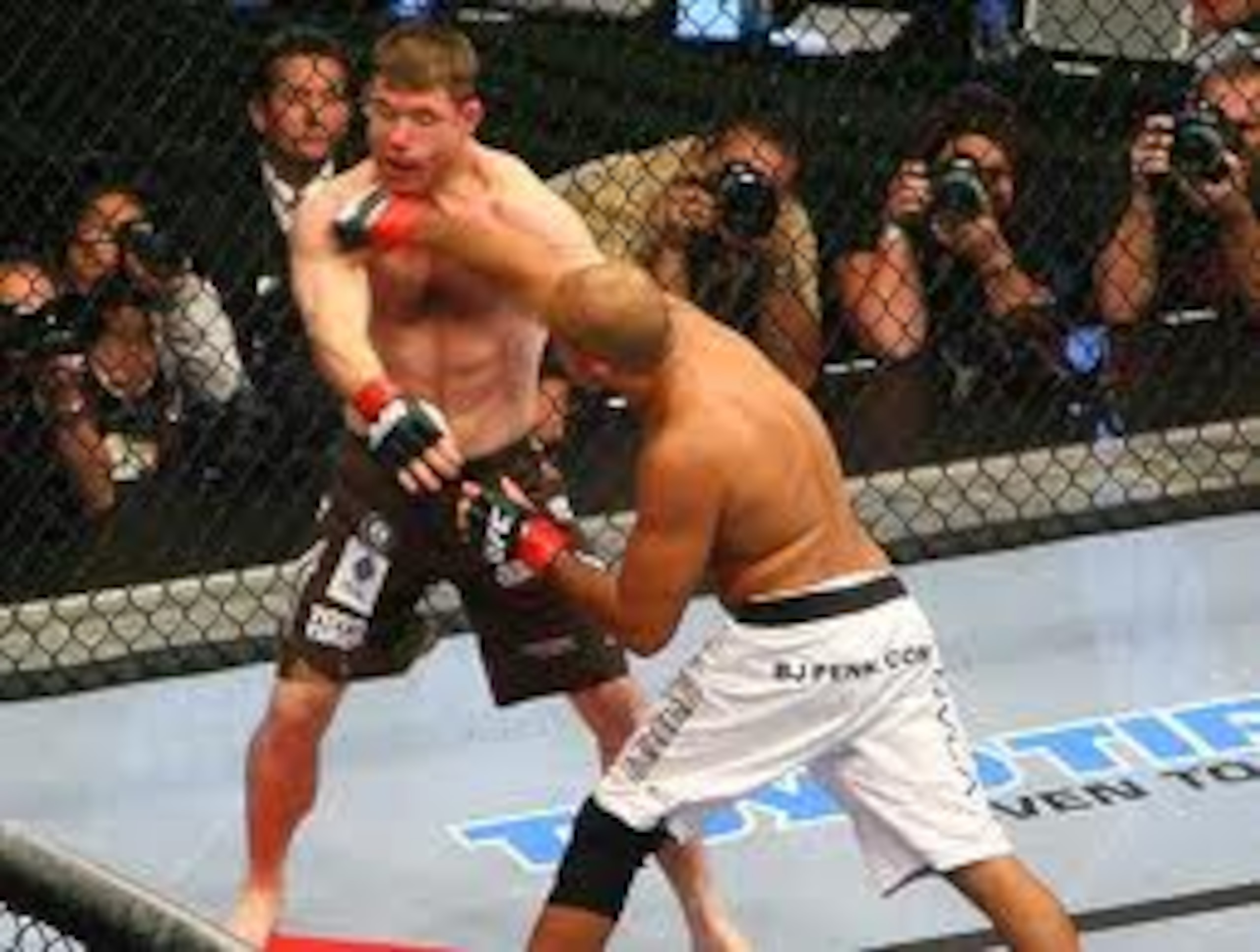 BJ Penn lands a solid right hand to KO Matt Hughes BJ Penn lands a solid right hand to KO Matt Hughes
