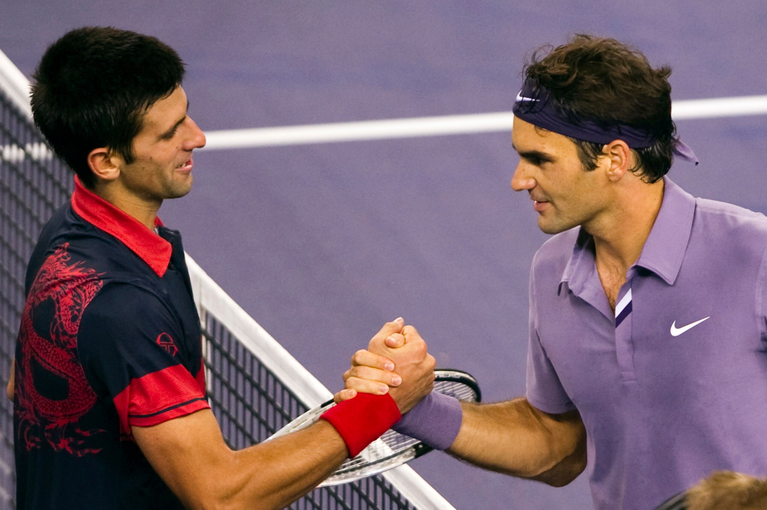SHANGHAI, CHINA - OCTOBER 16: Novak Djokovic (L) of Serbia congratulates Roger Federer of Switzerland at the end of their match during day six of the 2010 Shanghai Rolex Masters at the Shanghai Qi Zhong Tennis Center on October 16, 2010 in Shanghai, China