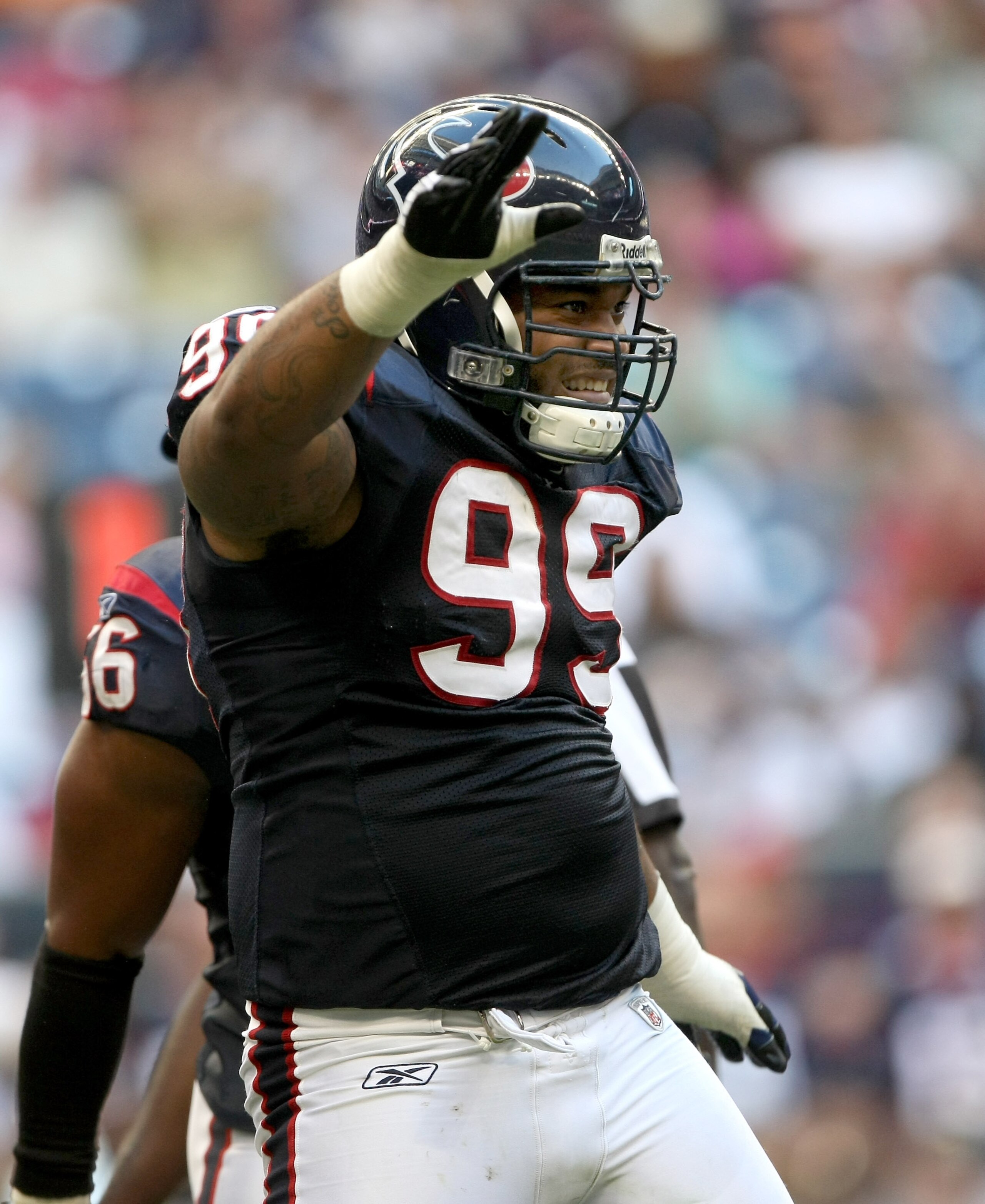 HOUSTON - OCTOBER 26: Defensive tackle Travis Johnson #99 of the Houston Texans celebrates after making a sack against the Cincinnati Bengals on October 26, 2008 at Reliant Stadium in Houston, Texas. The Texans won 35-6. (Photo by Stephen Dunn/Getty Ima HOUSTON - OCTOBER 26: Defensive tackle Travis Johnson #99 of the Houston Texans celebrates after making a sack against the Cincinnati Bengals on October 26, 2008 at Reliant Stadium in Houston, Texas. The Texans won 35-6. (Photo by Stephen Dunn/Getty Ima