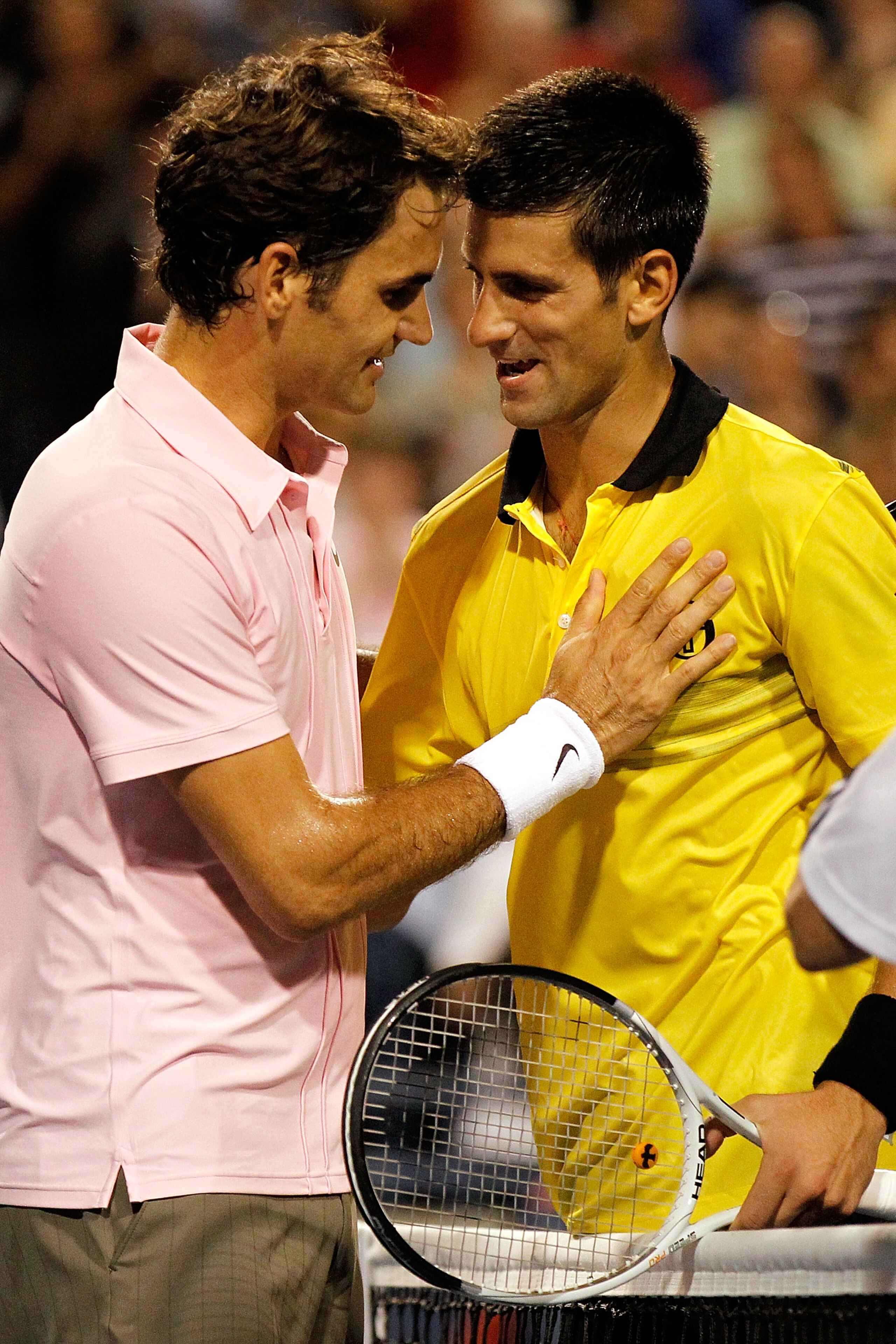 TORONTO, ON - AUGUST 14:  Roger Federer of Switzerland is congratulated at the net by Novak Djokovic of Serbia after their match during the semifinals of the Rogers Cup at the Rexall Centre on August 14, 2010 in Toronto, Canada.  (Photo by Matthew Stockma
