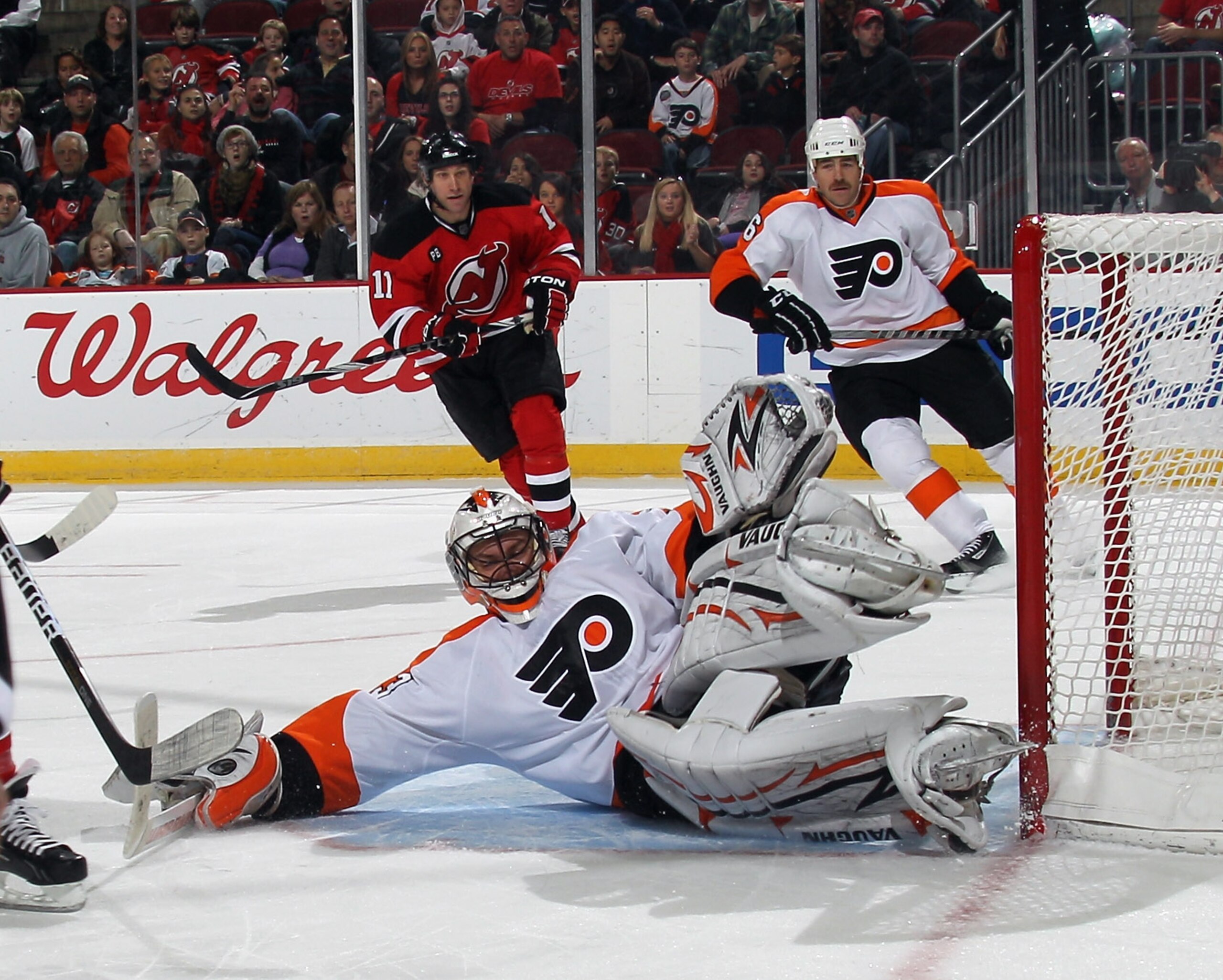 NEWARK, NJ - NOVEMBER 27: Brian Boucher #33 of the Philadelphia Flyers sprawls to make the save on David Clarkson #23 (not shown) of the New Jersey Devils at the Prudential Center on November 27, 2010 in Newark, New Jersey.  (Photo by Bruce Bennett/Getty
