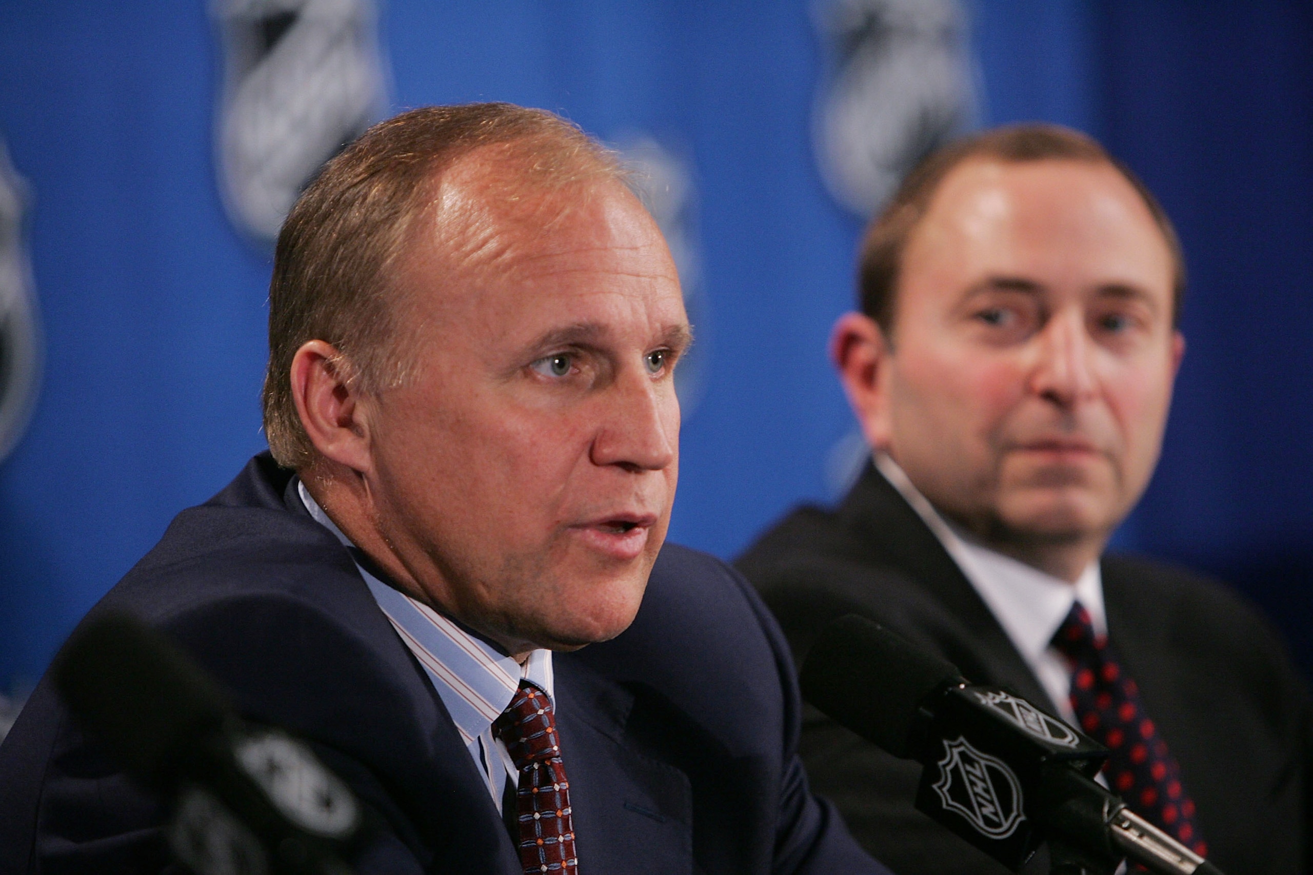 NEW YORK - JULY 22:  Colin Campbell (L), Executive Vice President and Director of Hockey Operations, and Commissioner Gary Bettman of the National Hockey League address the media regarding NHL rules changes and the new CBA agreement at the Sheraton New Yo