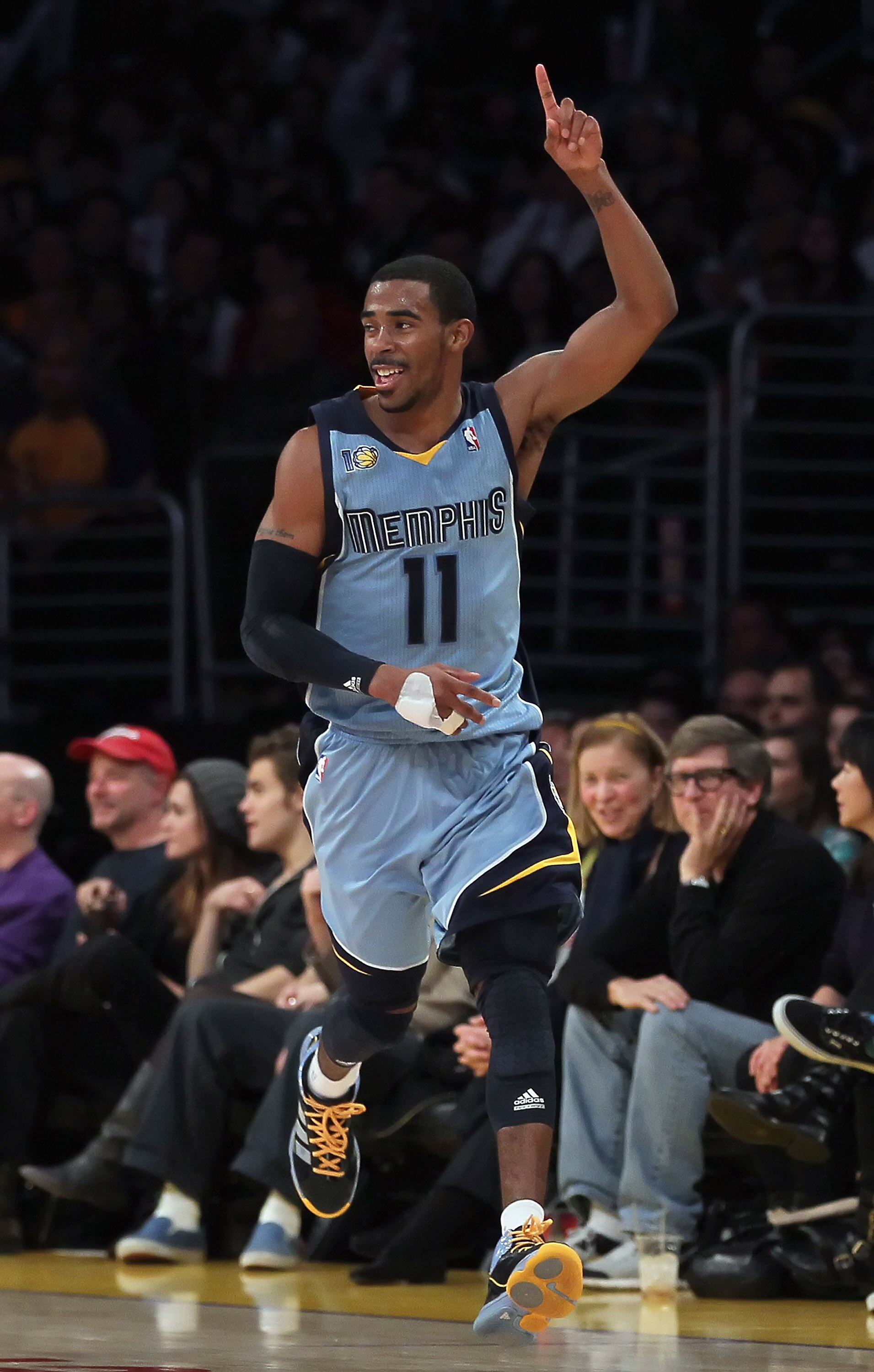 LOS ANGELES, CA - JANUARY 02:  Mike Conley #11 of the Memphis Grizzlies reacts after making a shot against the Los Angeles Lakers during the second half at Staples Center on January 2, 2011 in Los Angeles, California. The Grizzlies defeated the Lakers 104
