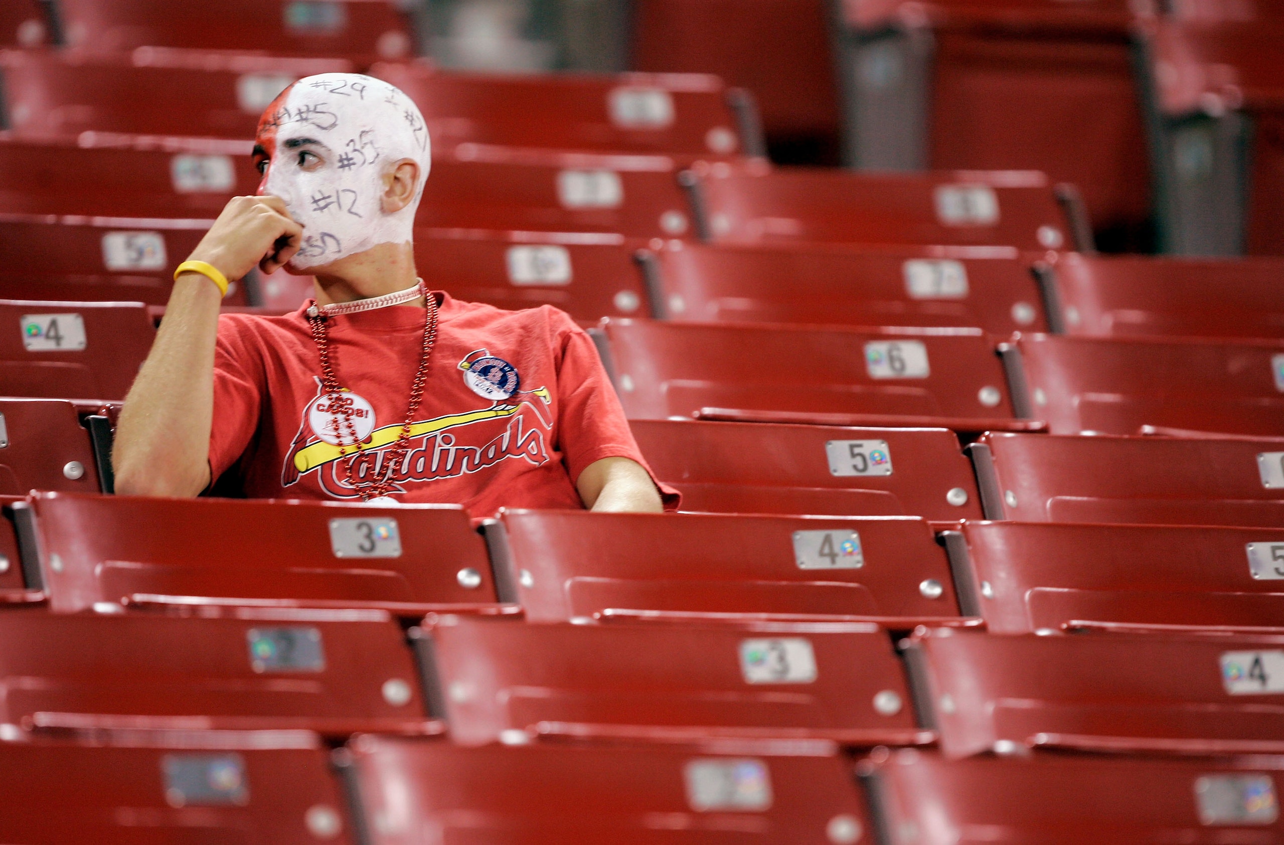 ST. LOUIS - OCTOBER 19:  A lone fan of the St. Louis Cardinals sits dejected following the Cardinals 5-1 loss to the Houston Astros in Game Six of the National League Championship Series October 19, 2005 at Busch Stadium in St. Louis, Missouri. The Astros