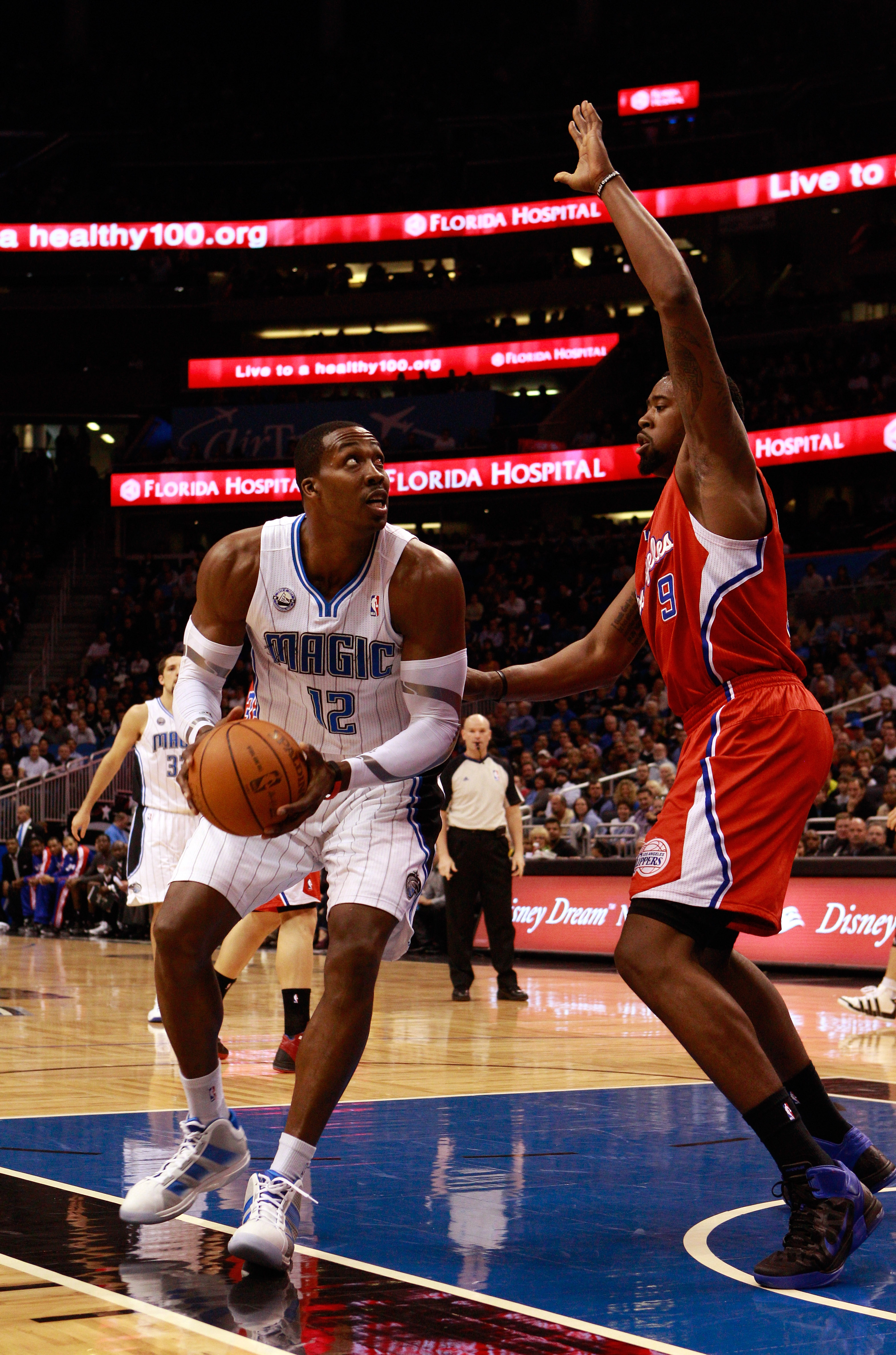 ORLANDO, FL - FEBRUARY 08:  Dwight Howard #12 of the Orlando Magic attempts a shot against DeAndre Jordan #9 of the Los Angeles Clippers during the game at Amway Arena on February 8, 2011 in Orlando, Florida.  NOTE TO USER: User expressly acknowledges and