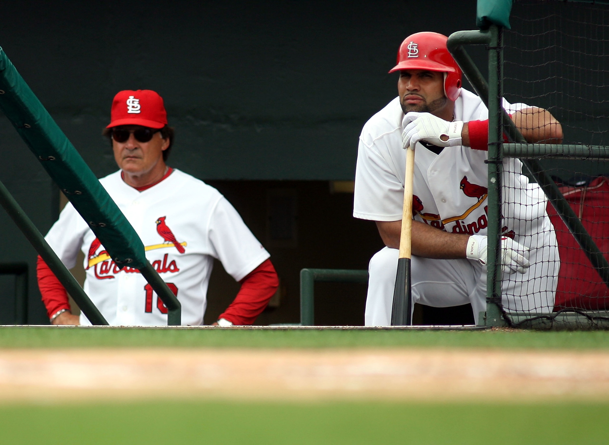 JUPITER, FL - MARCH 29:  Manager Tony La Russa #10 and Albert Pujols #5 of the St. Louis Cardinals stand in the duggout during a game against the Minnesota Twins at Roger Dean Stadium on March 29, 2010 in Jupiter, Florida.  (Photo by Marc Serota/Getty Ima
