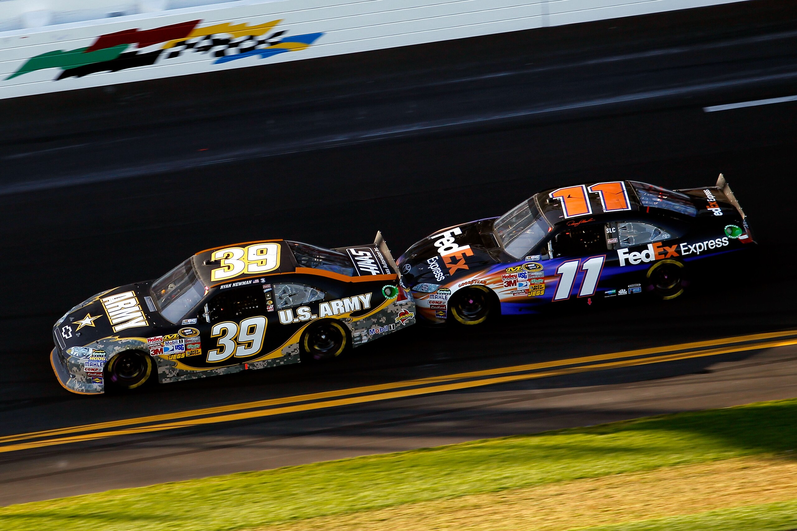 DAYTONA BEACH, FL - FEBRUARY 20: Ryan Newman, driver of the #39 U.S. Army Chevrolet, and Denny Hamlin, driver of the #11 FedEx Toyota, race during the NASCAR Sprint Cup Series Daytona 500 at Daytona International Speedway on February 20, 2011 in Daytona DAYTONA BEACH, FL - FEBRUARY 20: Ryan Newman, driver of the #39 U.S. Army Chevrolet, and Denny Hamlin, driver of the #11 FedEx Toyota, race during the NASCAR Sprint Cup Series Daytona 500 at Daytona International Speedway on February 20, 2011 in Daytona
