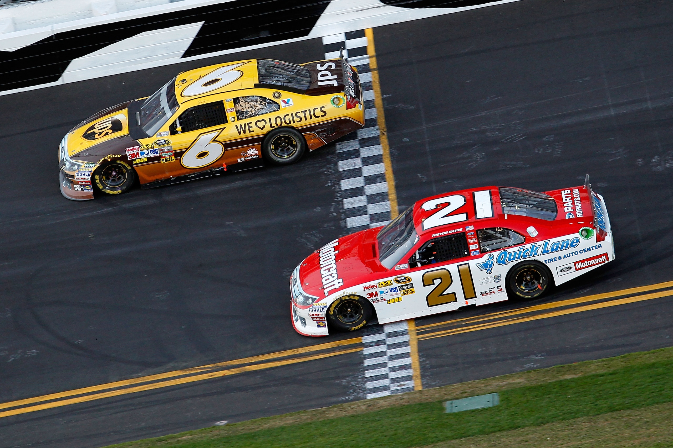 DAYTONA BEACH, FL - FEBRUARY 20: David Ragan, driver of the #6 UPS Ford, and Trevor Bayne, driver of the #21 Motorcraft/Quick Lane Ford, race during the NASCAR Sprint Cup Series Daytona 500 at Daytona International Speedway on February 20, 2011 in Dayton DAYTONA BEACH, FL - FEBRUARY 20: David Ragan, driver of the #6 UPS Ford, and Trevor Bayne, driver of the #21 Motorcraft/Quick Lane Ford, race during the NASCAR Sprint Cup Series Daytona 500 at Daytona International Speedway on February 20, 2011 in Dayton