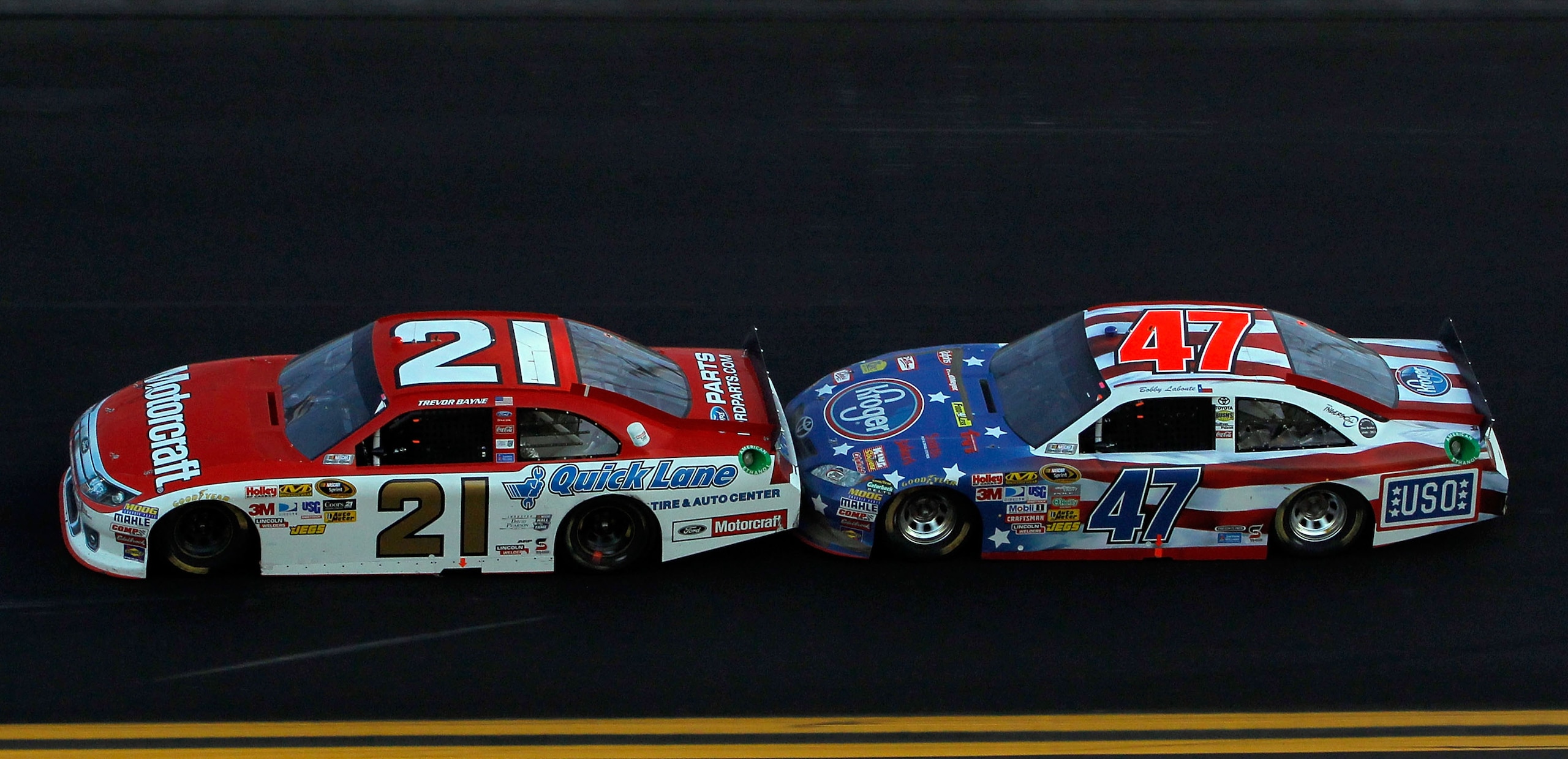 DAYTONA BEACH, FL - FEBRUARY 20: Trevor Bayne, driver of the #21 Motorcraft/Quick Lane Ford, and Bobby Labonte, driver of the #47 Kroger/USO Toyota, race during the NASCAR Sprint Cup Series Daytona 500 at Daytona International Speedway on February 20, 20 DAYTONA BEACH, FL - FEBRUARY 20: Trevor Bayne, driver of the #21 Motorcraft/Quick Lane Ford, and Bobby Labonte, driver of the #47 Kroger/USO Toyota, race during the NASCAR Sprint Cup Series Daytona 500 at Daytona International Speedway on February 20, 20