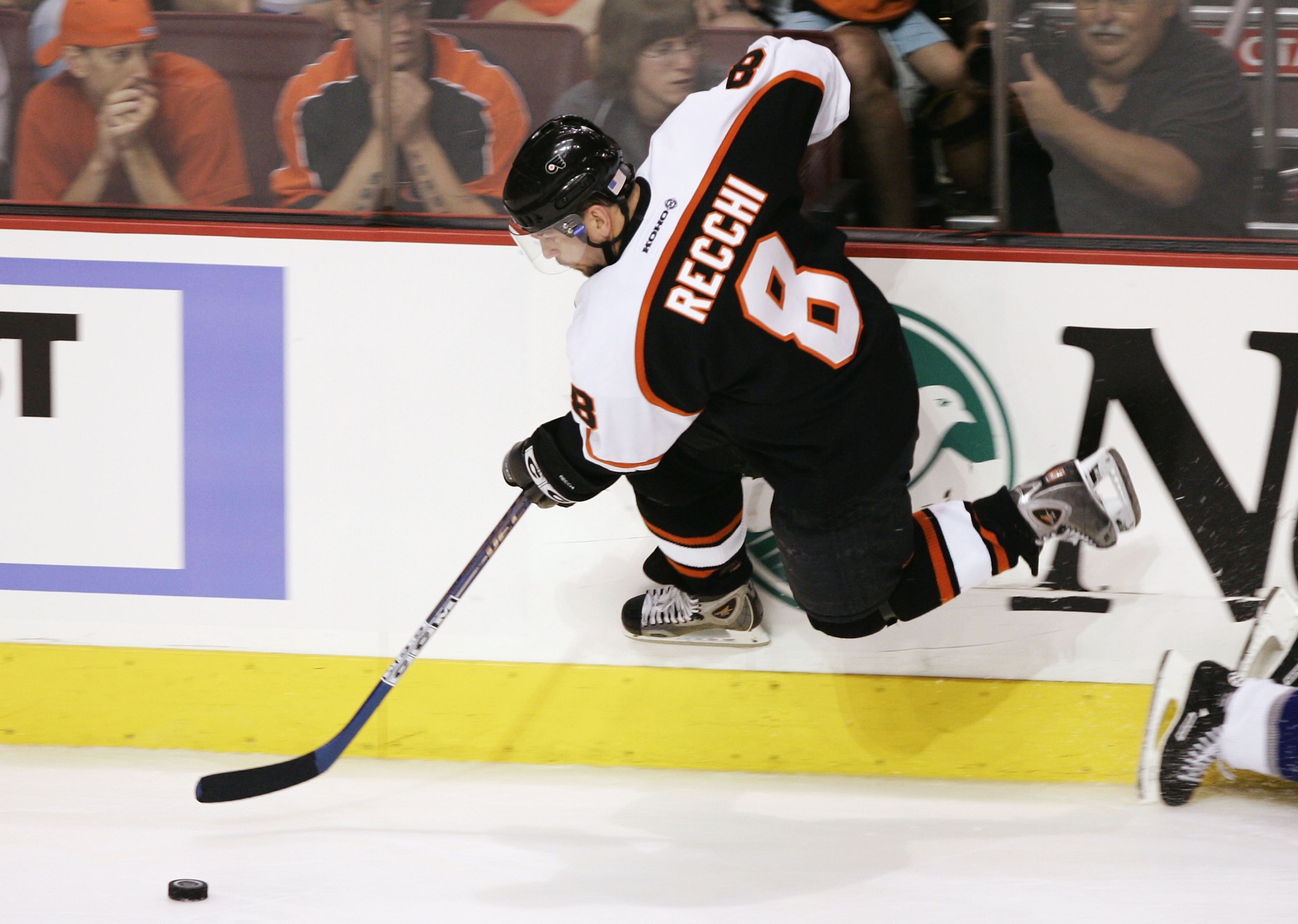 PHILADELPHIA - MAY 13:  Mark Recchi #8 of the Philadelphia Flyers jumps off the boards to advance the puck against the Tampa Bay Lightning in game three of the 2004 NHL Eastern Conference Finals during the Stanley Cup Playoffs on May 13, 2004 at the Wacho