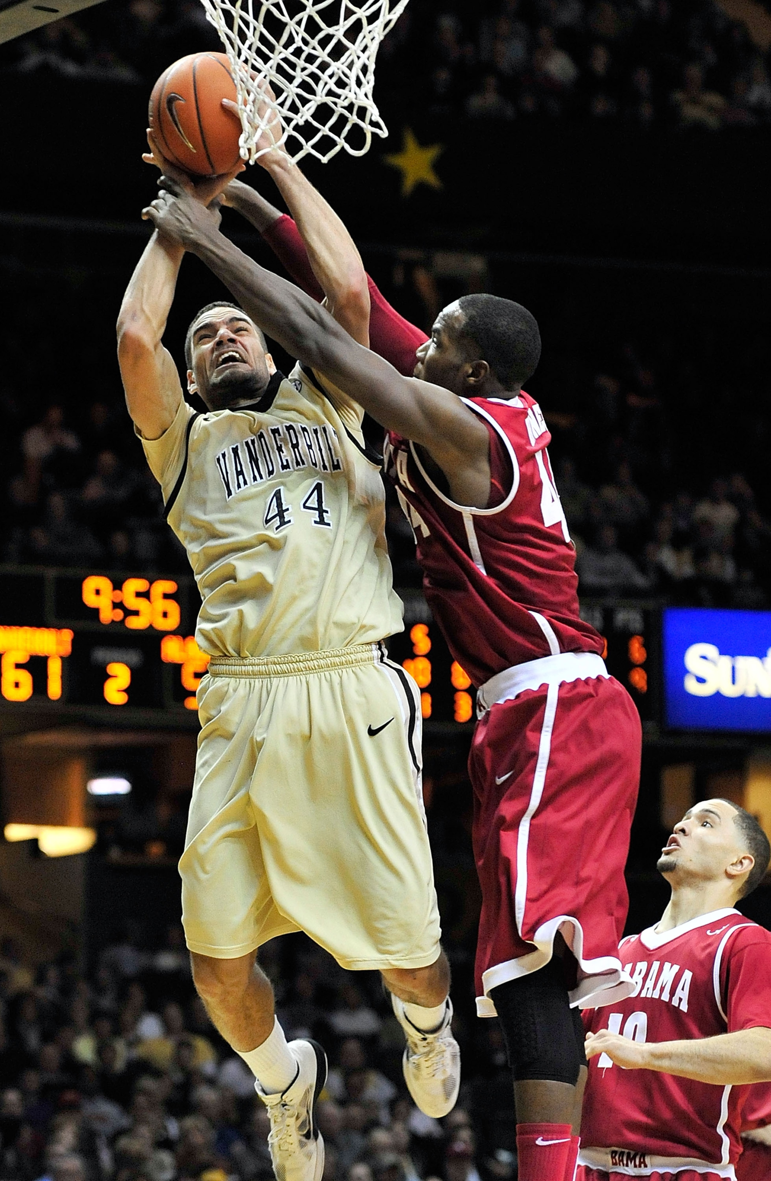 NASHVILLE, TN - FEBRUARY 10:  Jeffery Taylor #44 of the Vanderbilt Commodores is fouled by Chris Hines #44 of the Alabama Crimson Tide at Memorial Gym on February 10, 2011 in Nashville, Tennessee. Vanderbilt won 81-77. (Photo by Grant Halverson/Getty Imag