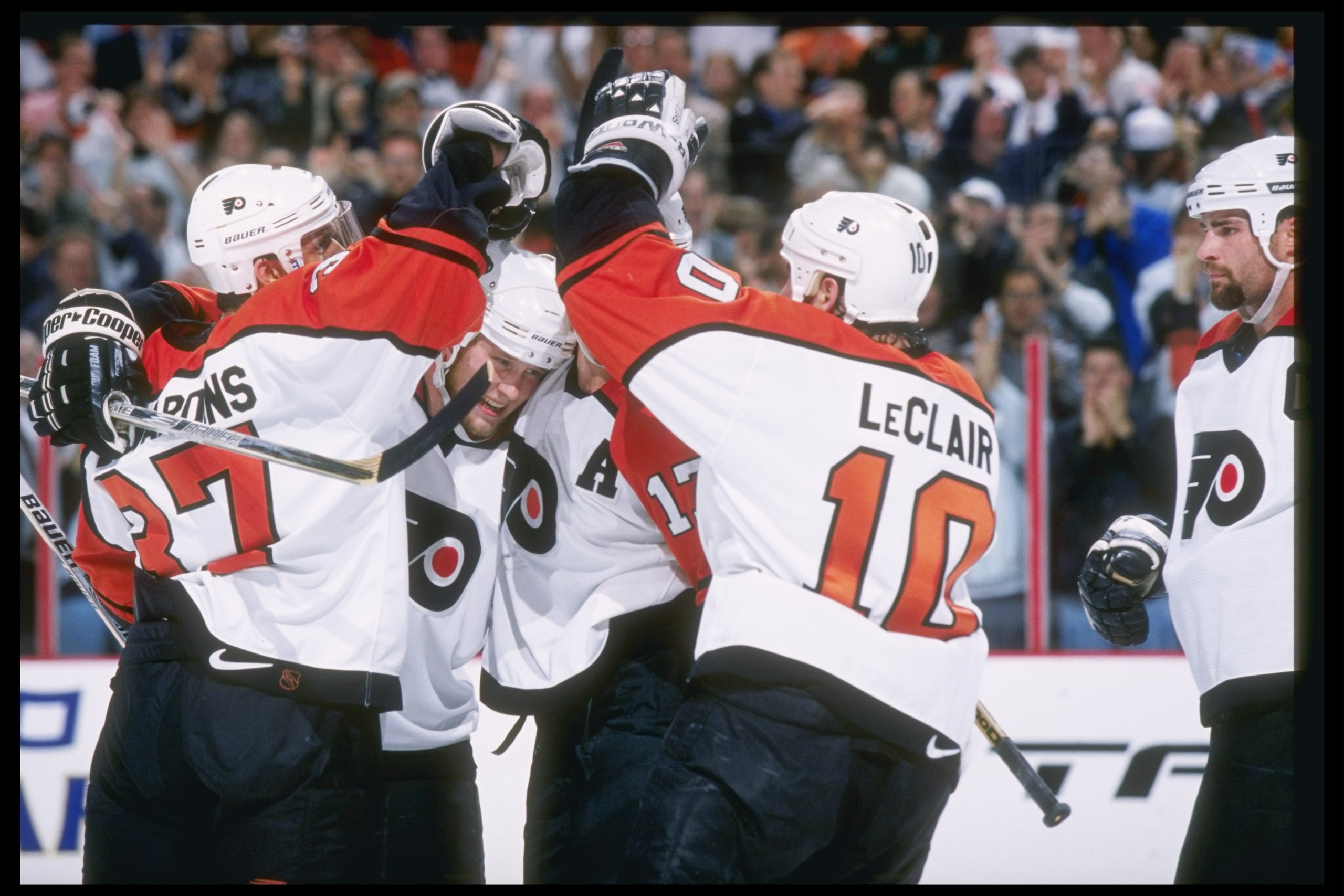 3 Jun 1997:  Defenseman Janne Niinimaa, center John LeClair and defenseman Eric Desjardins of the Philadelphia Flyers celebrate a goal during Game 2 of the Stanley Cup Finals against the Detroit Red Wings at the CoreStates Center in Philadelphia, Pennsylv
