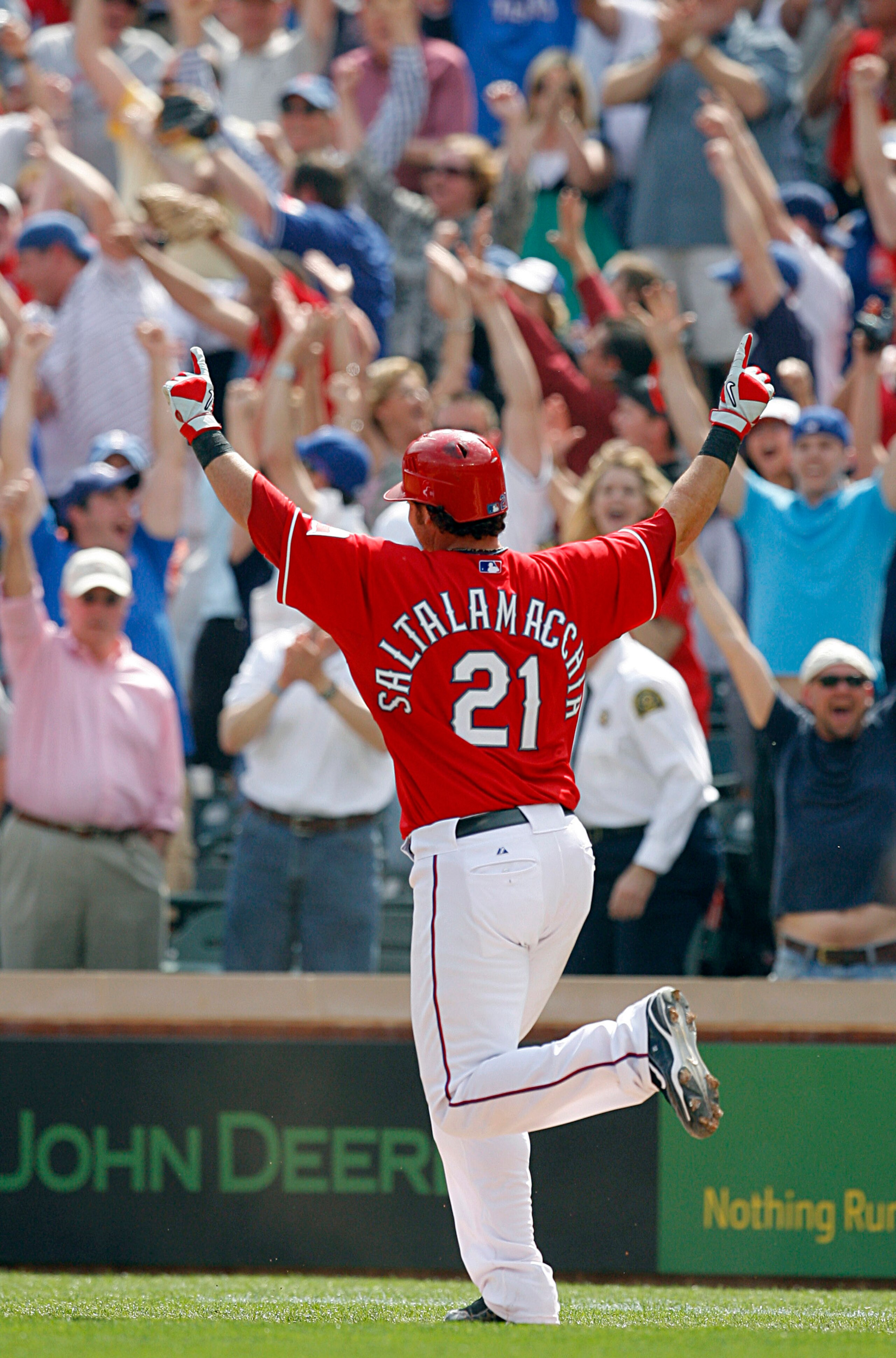 ARLINGTON, TX - APRIL 05:  Catcher Jarrod Saltalamacchia #21 of the Texas Rangers celebrates a walkoff RBI against the Toronto Blue Jays in the bottom of the ninth inning on Opening Day at Rangers Ballpark on April 5, 2010 in Arlington, Texas.  The Ranger