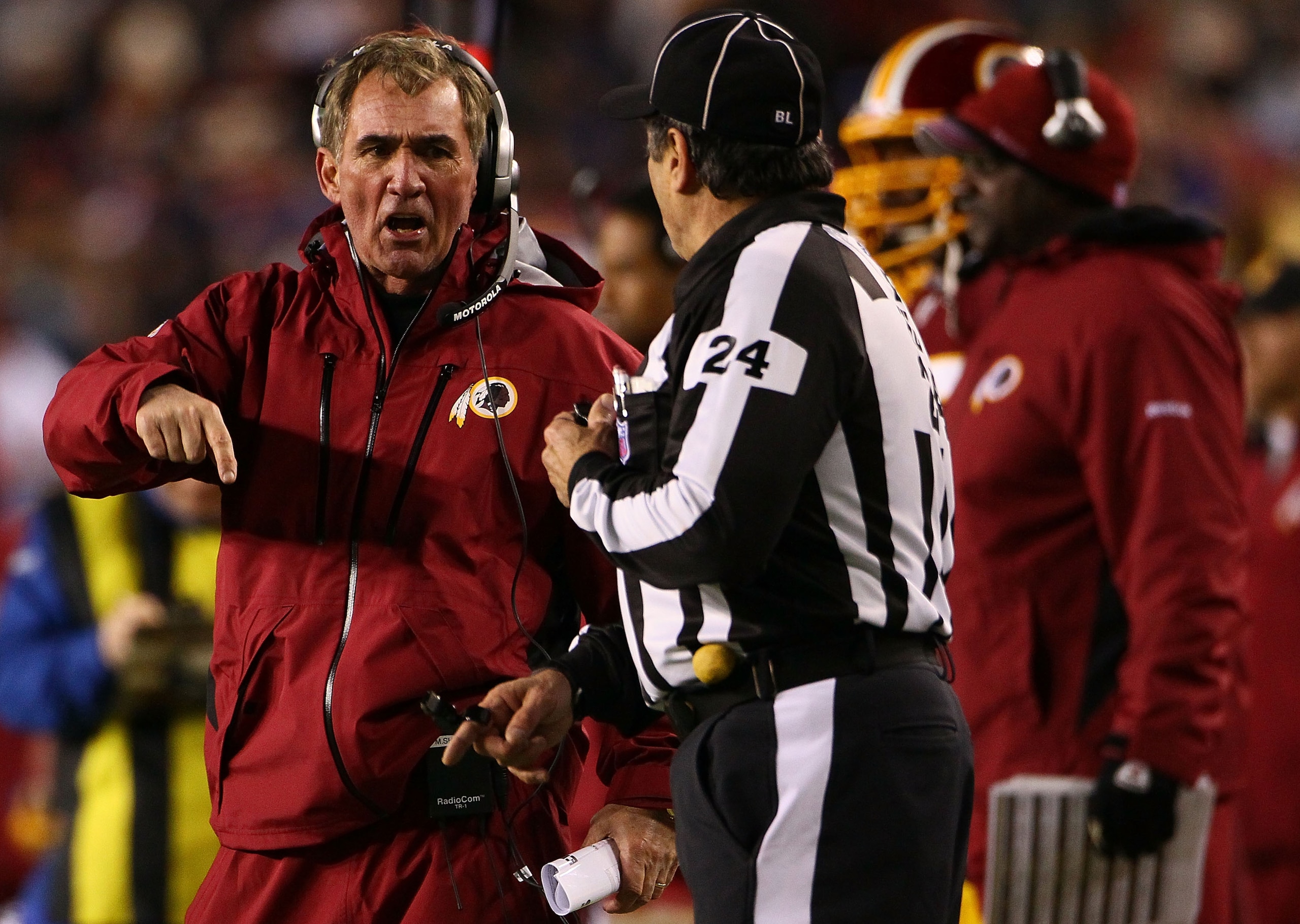 LANDOVER, MD - JANUARY 02:  Washington Redskins head coach Mike Shanahan makes a point with a referee in the fourth quarter of a game against the New York Giants at FedEx Field on January 2, 2011 in Landover, Maryland. The Giants won the game 17-14.  (Pho