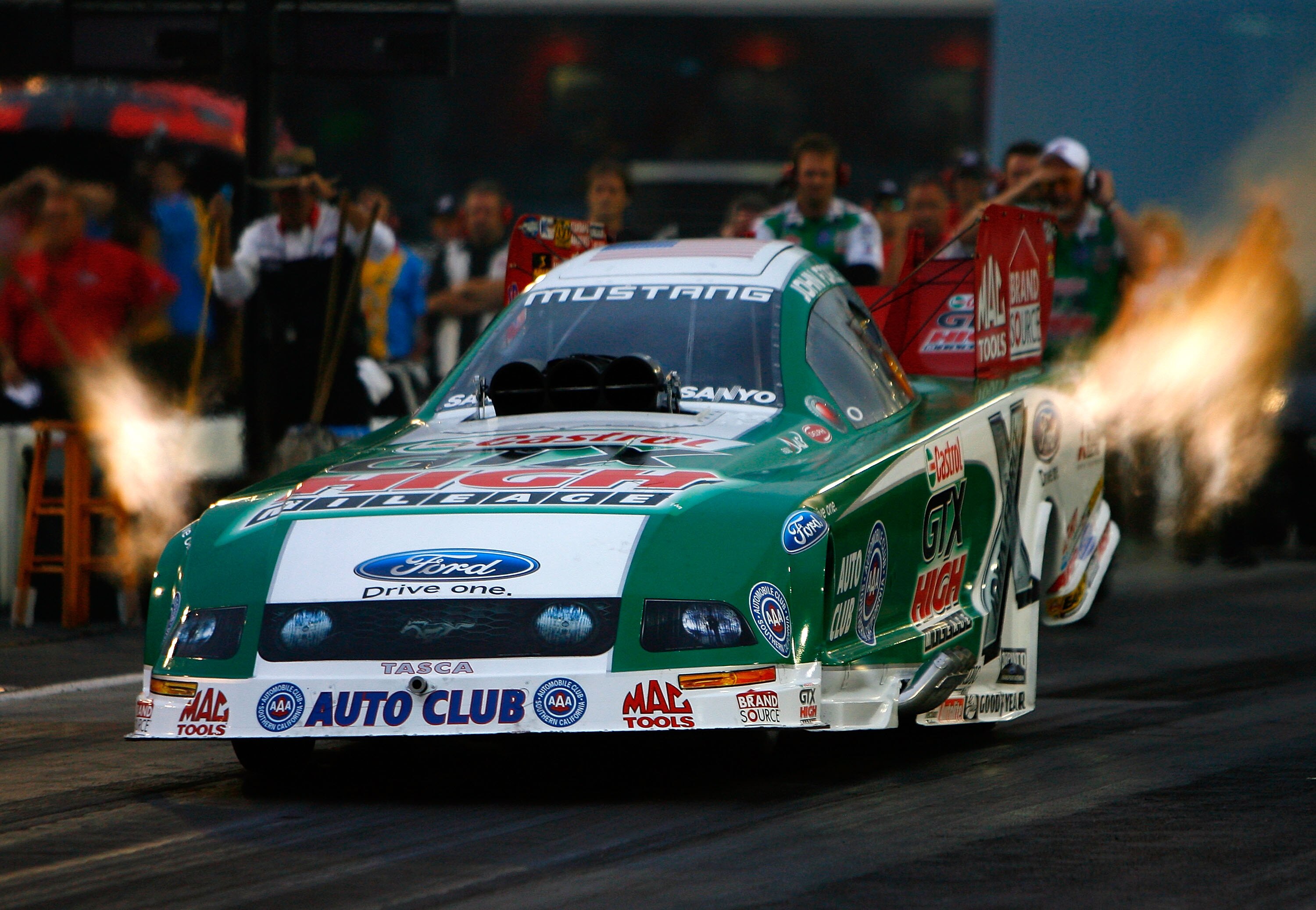 CONCORD, NC - SEPTEMBER 18:  John Force, driver of the Castrol GTX High Mileage Ford drives during second round qualifying for the NHRA Carolinas Nationals on September 18, 2009 at Zmax Dragway in Concord, North Carolina.  (Photo by Rusty Jarrett/Getty Im