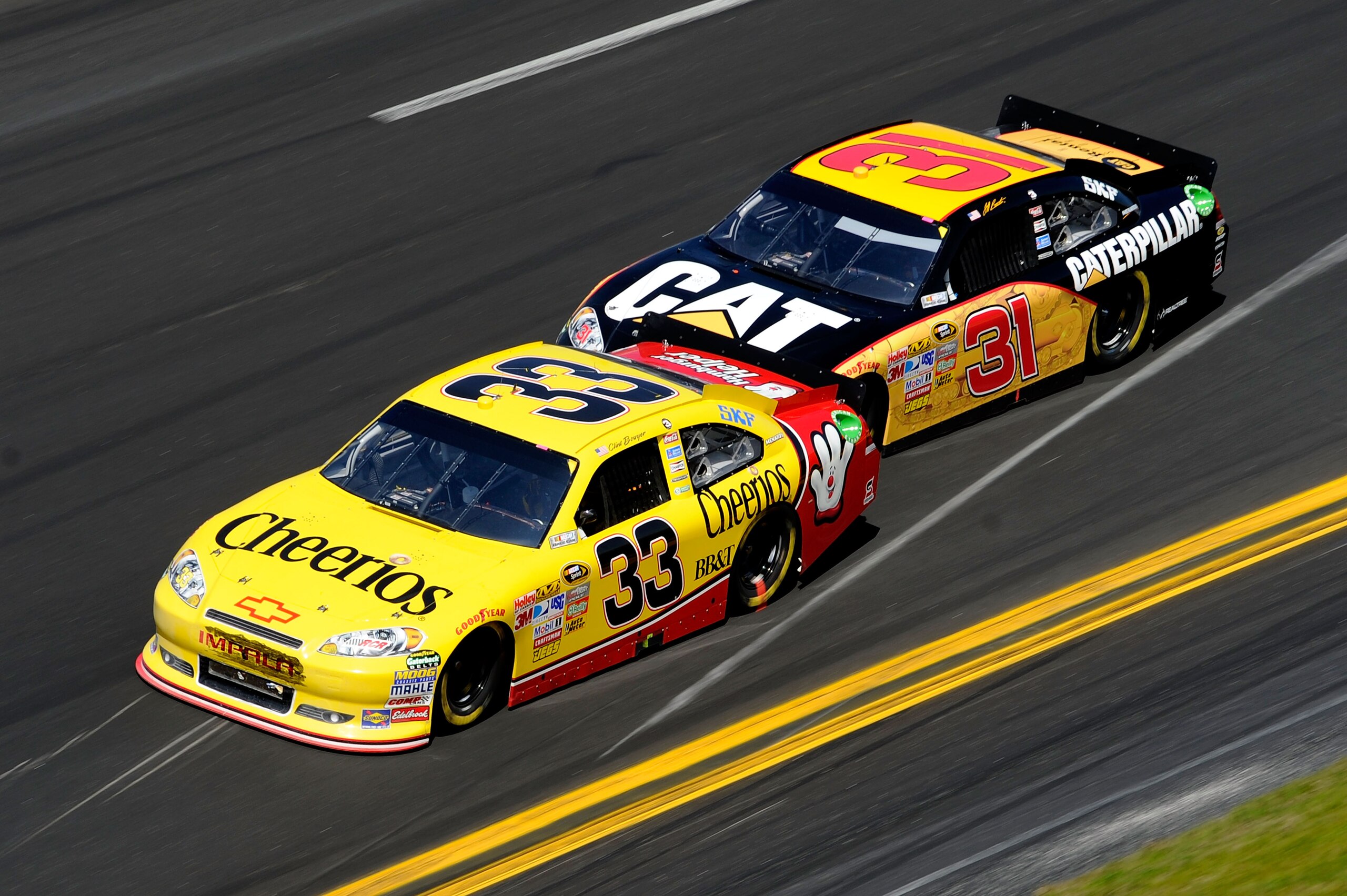 DAYTONA BEACH, FL - FEBRUARY 20: Clint Bowyer, driver of the #33 Cheerios Chevrolet, and Jeff Burton, driver of the #31 Caterpillar Chevrolet, race during the NASCAR Sprint Cup Series Daytona 500 at Daytona International Speedway on February 20, 2011 in DAYTONA BEACH, FL - FEBRUARY 20: Clint Bowyer, driver of the #33 Cheerios Chevrolet, and Jeff Burton, driver of the #31 Caterpillar Chevrolet, race during the NASCAR Sprint Cup Series Daytona 500 at Daytona International Speedway on February 20, 2011 in