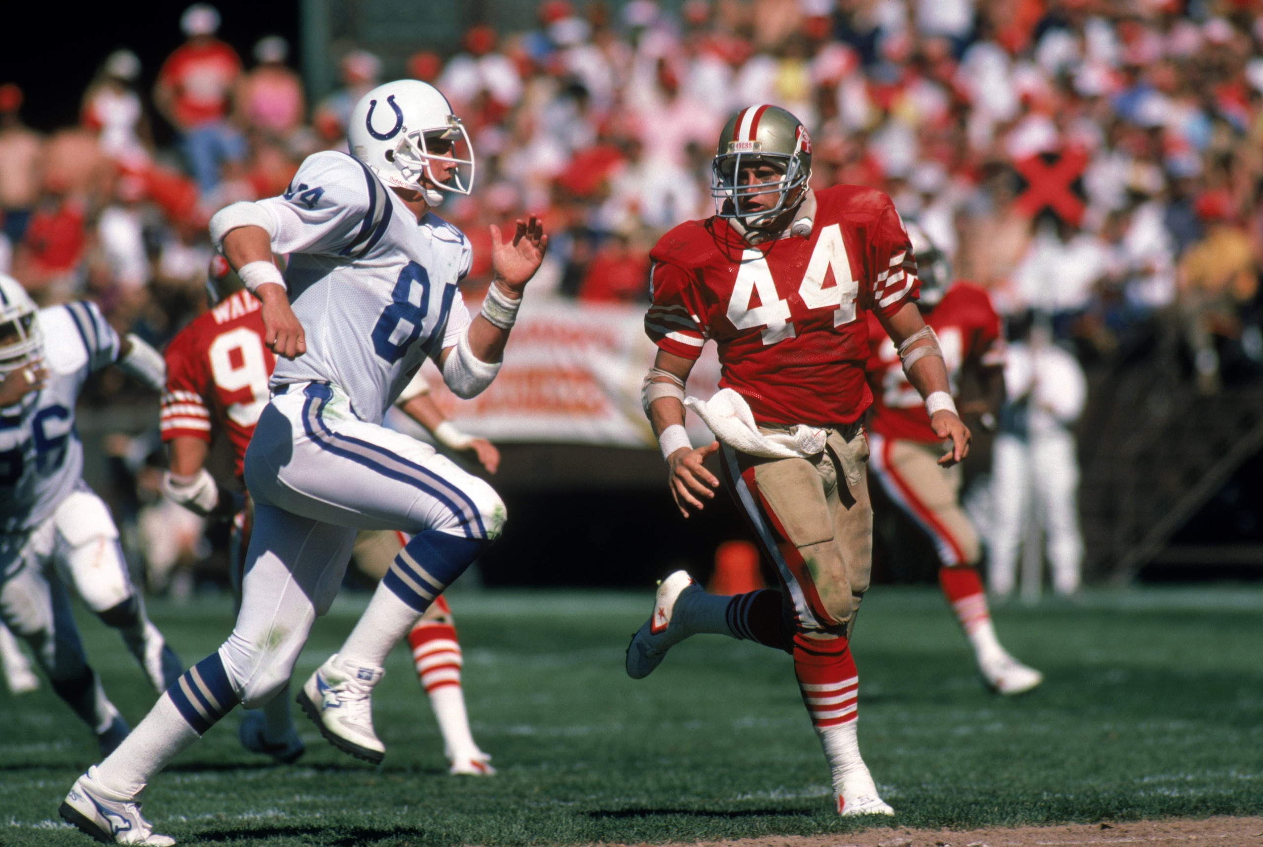 SAN FRANCISCO - OCTOBER 5: Full back Tom Rathman #44 of the San Francisco 49ers looks to make a block against Indianapolis Colts tight end Mark Boyer #84 during a game at Candlestick Park on October 5, 1986 in San Francisco, California. The 49ers won 35 SAN FRANCISCO - OCTOBER 5: Full back Tom Rathman #44 of the San Francisco 49ers looks to make a block against Indianapolis Colts tight end Mark Boyer #84 during a game at Candlestick Park on October 5, 1986 in San Francisco, California. The 49ers won 35