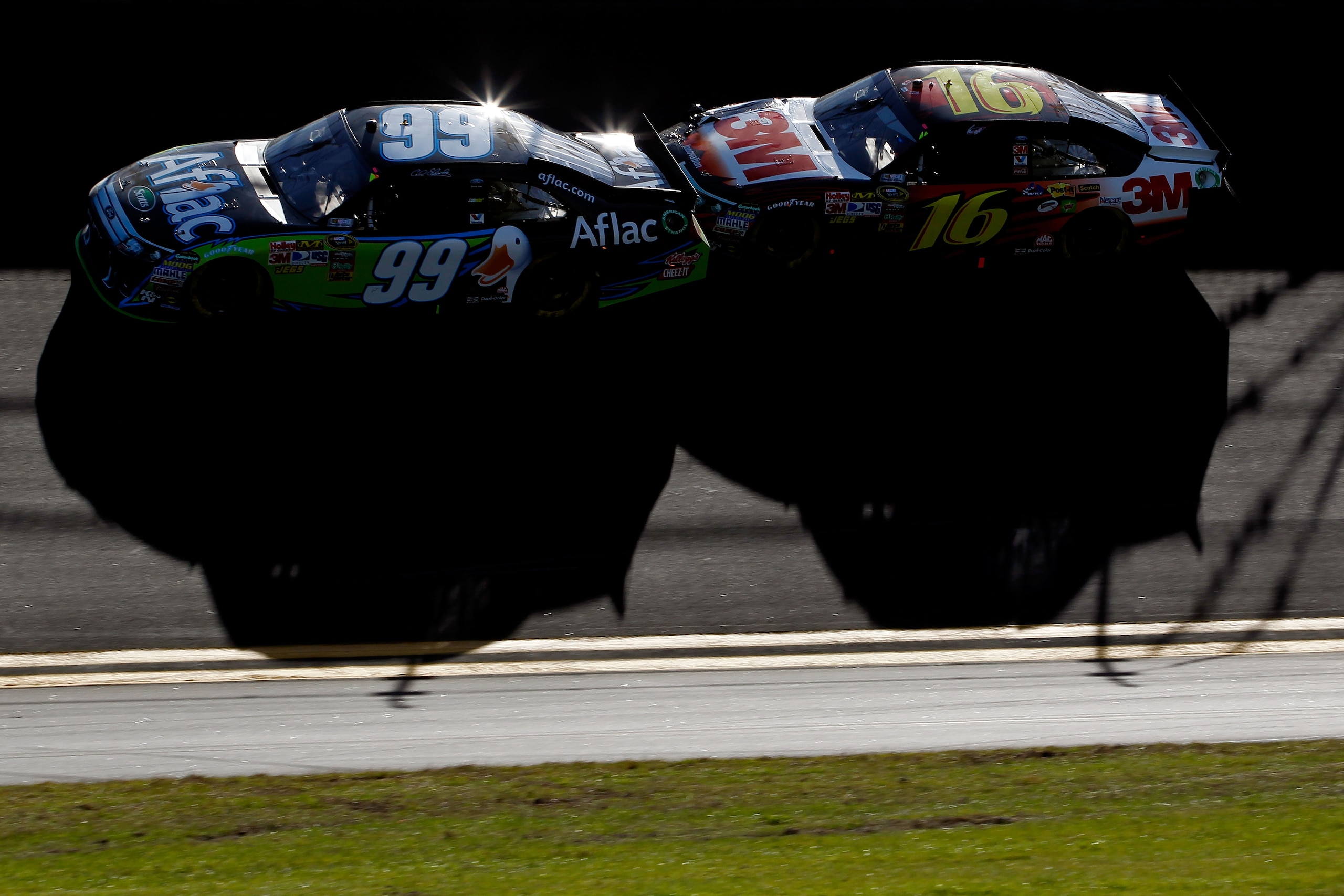 DAYTONA BEACH, FL - FEBRUARY 20: Carl Edwards, driver of the #99 Aflac Ford, and Greg Biffle, driver of the #16 3M Ford, race during the NASCAR Sprint Cup Series Daytona 500 at Daytona International Speedway on February 20, 2011 in Daytona Beach, Florida DAYTONA BEACH, FL - FEBRUARY 20: Carl Edwards, driver of the #99 Aflac Ford, and Greg Biffle, driver of the #16 3M Ford, race during the NASCAR Sprint Cup Series Daytona 500 at Daytona International Speedway on February 20, 2011 in Daytona Beach, Florida