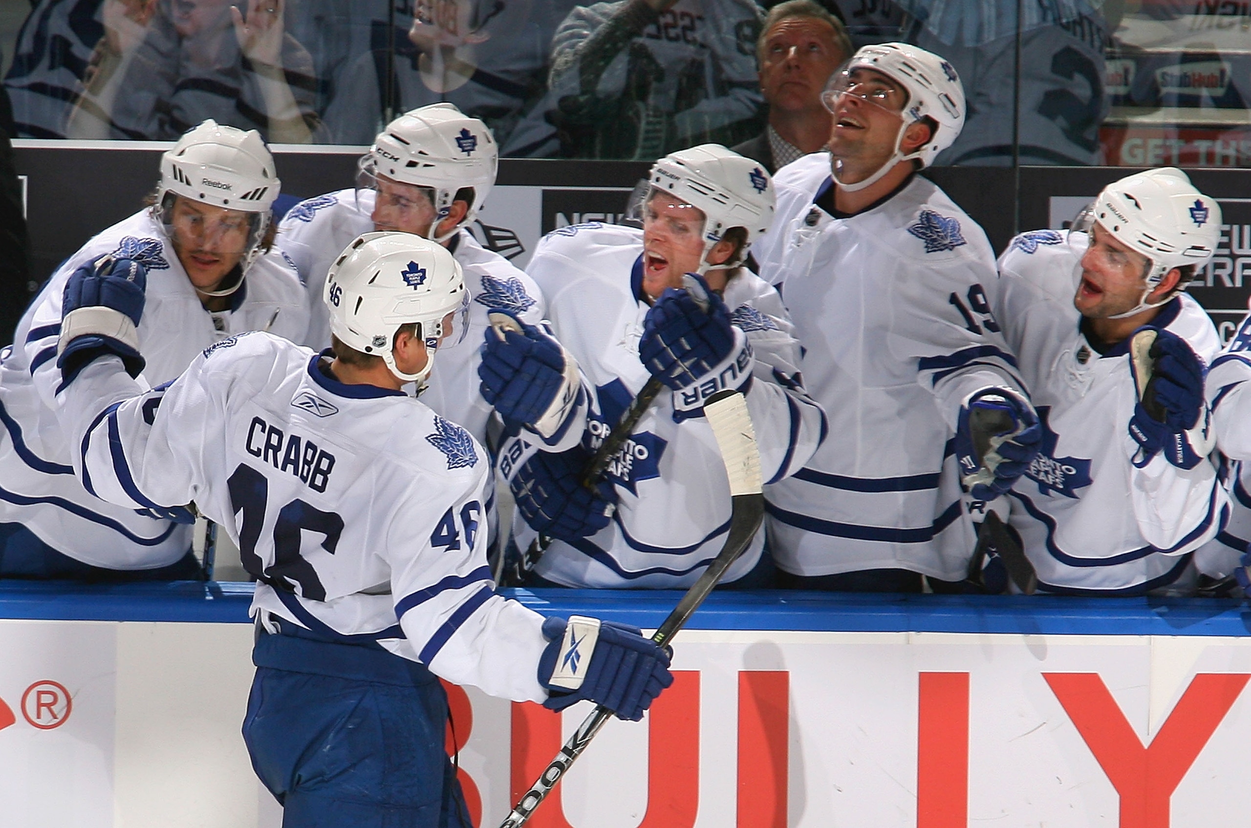 BUFFALO, NY - FEBRUARY 16: Joey Crabb #46 of the Toronto Maple Leafs celebrates scoring the game-winning goal with his teammates against the Buffalo Sabres  at HSBC Arena on February 16, 2011 in Buffalo, New York. Toronto won 2-1. (Photo by Rick Stewart/G