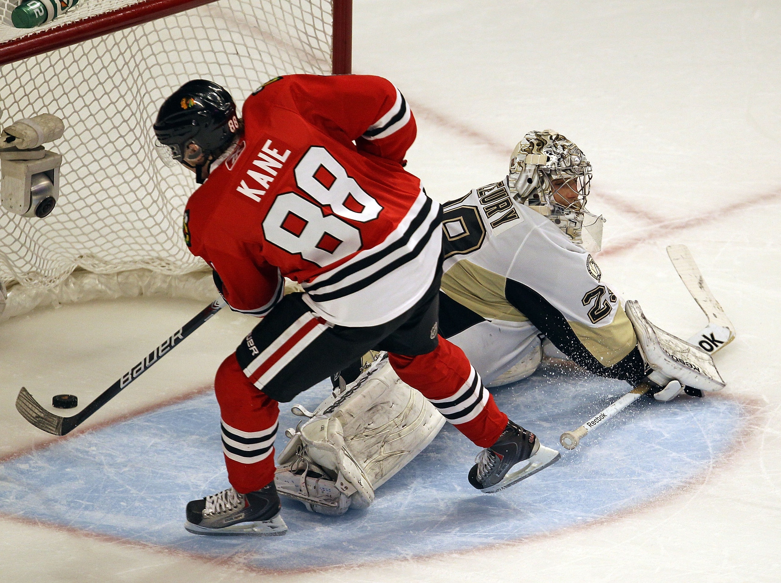 CHICAGO, IL - FEBRUARY 20: Patrick Kane #88 of the Chicago Blackhawks scores the winning goal during a shootout against Marc-Andre Fleury #29 of the Pittsburgh Penguins at the United Center on February 20, 2011 in Chicago, Illinois. The Blackhawks defeate