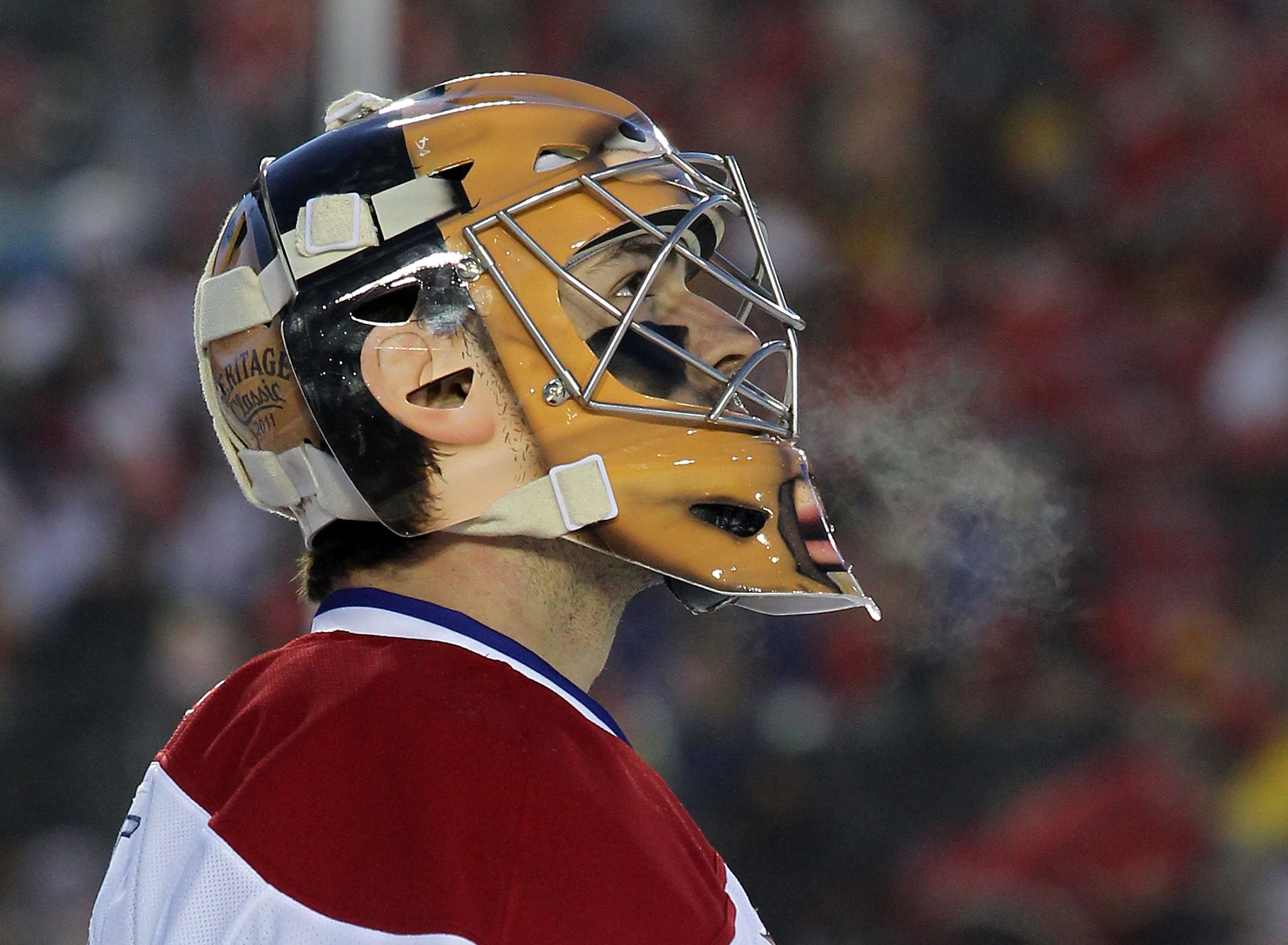 CALGARY, AB - FEBRUARY 20:  Carey Price #31 of the Montreal Canadiens shows the effects of the cold weather in third period against the Calgary Flames at the 2011 NHL Heritage Classic Game at McMahon Stadium on February 20, 2011 in Calgary, Alberta, Canad