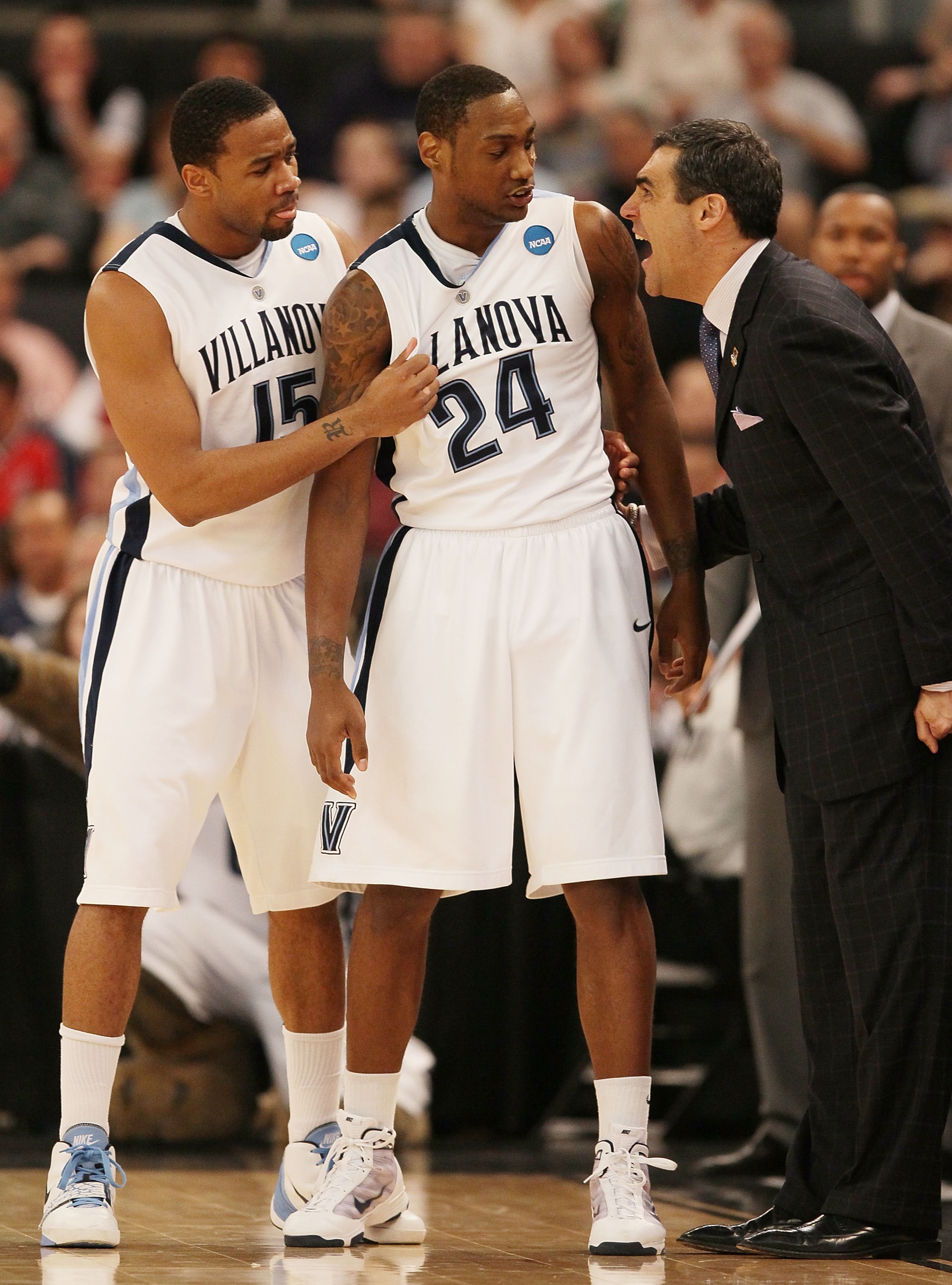 PROVIDENCE, RI - MARCH 20:  Head coach Jay Wright  of the Villanova Wildcats talks with Corey Stokes #24 and Reggie Redding #15 in the first half against the Saint Mary's Gaels during the second round of the 2010 NCAA men's basketball tournament on March