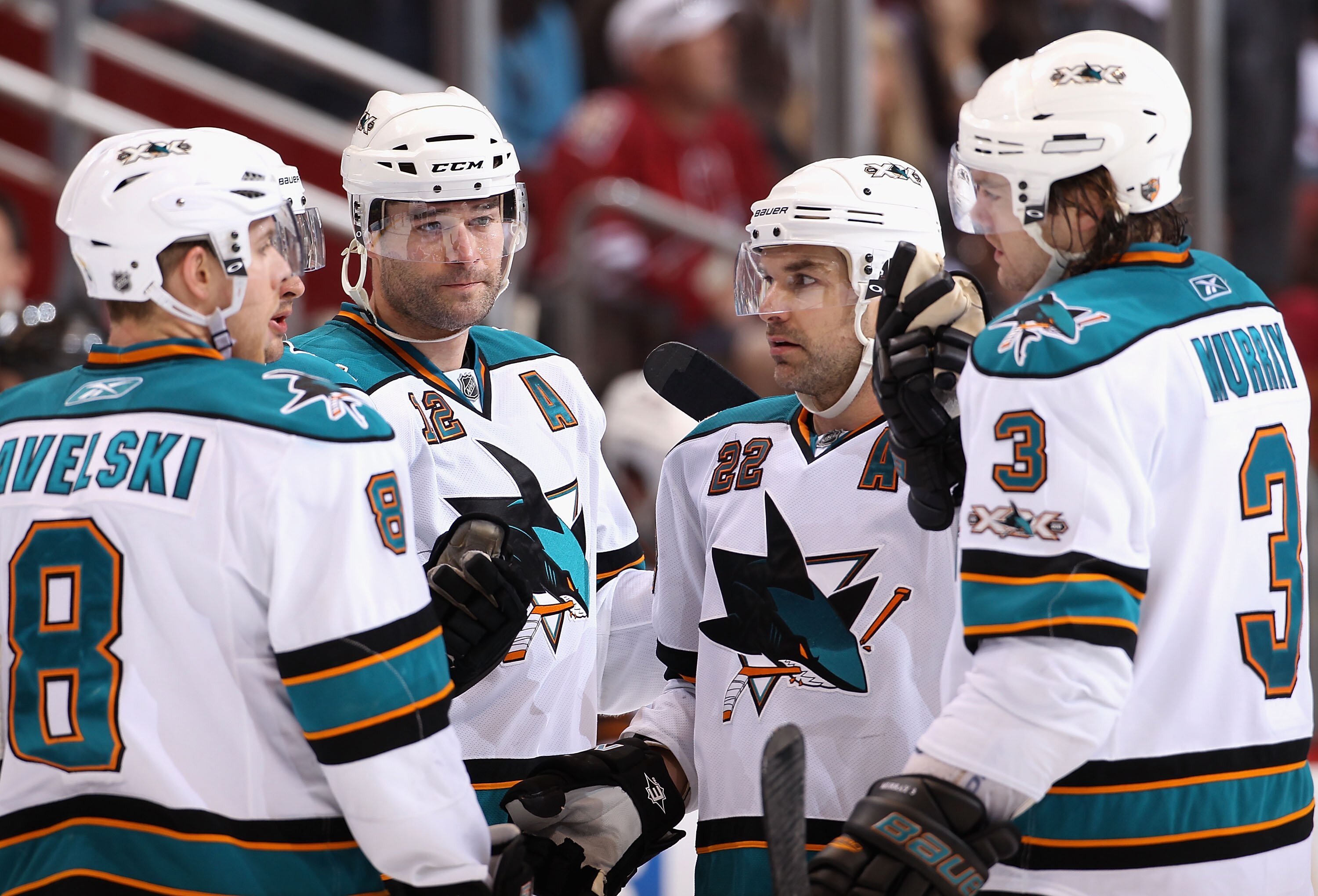 GLENDALE, AZ - JANUARY 17:  Joe Pavelski #8, Patrick Marleau #12, Dan Boyle #22 and Douglas Murray #3 of the San Jose Sharks talk during the NHL game against the Phoenix Coyotes at Jobing.com Arena on January 17, 2011 in Glendale, Arizona.  The Sharks def