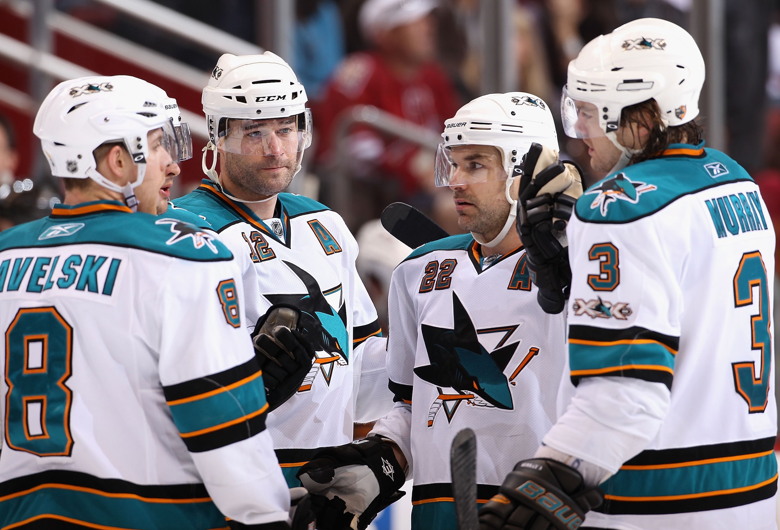 GLENDALE, AZ - JANUARY 17:  Joe Pavelski #8, Patrick Marleau #12, Dan Boyle #22 and Douglas Murray #3 of the San Jose Sharks talk during the NHL game against the Phoenix Coyotes at Jobing.com Arena on January 17, 2011 in Glendale, Arizona.  The Sharks def