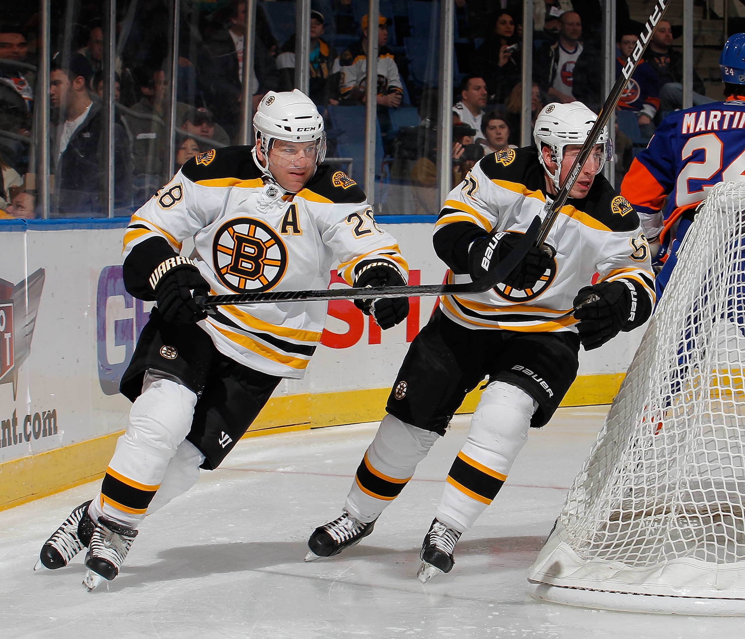 UNIONDALE, NY - FEBRUARY 17:  Mark Recchi #28 and Brad Marchand #63 of the Boston Bruins skate during an NHL hockey game against the New York Islanders at the Nassau Coliseum on February 17, 2011 in Uniondale, New York.  (Photo by Paul Bereswill/Getty Ima