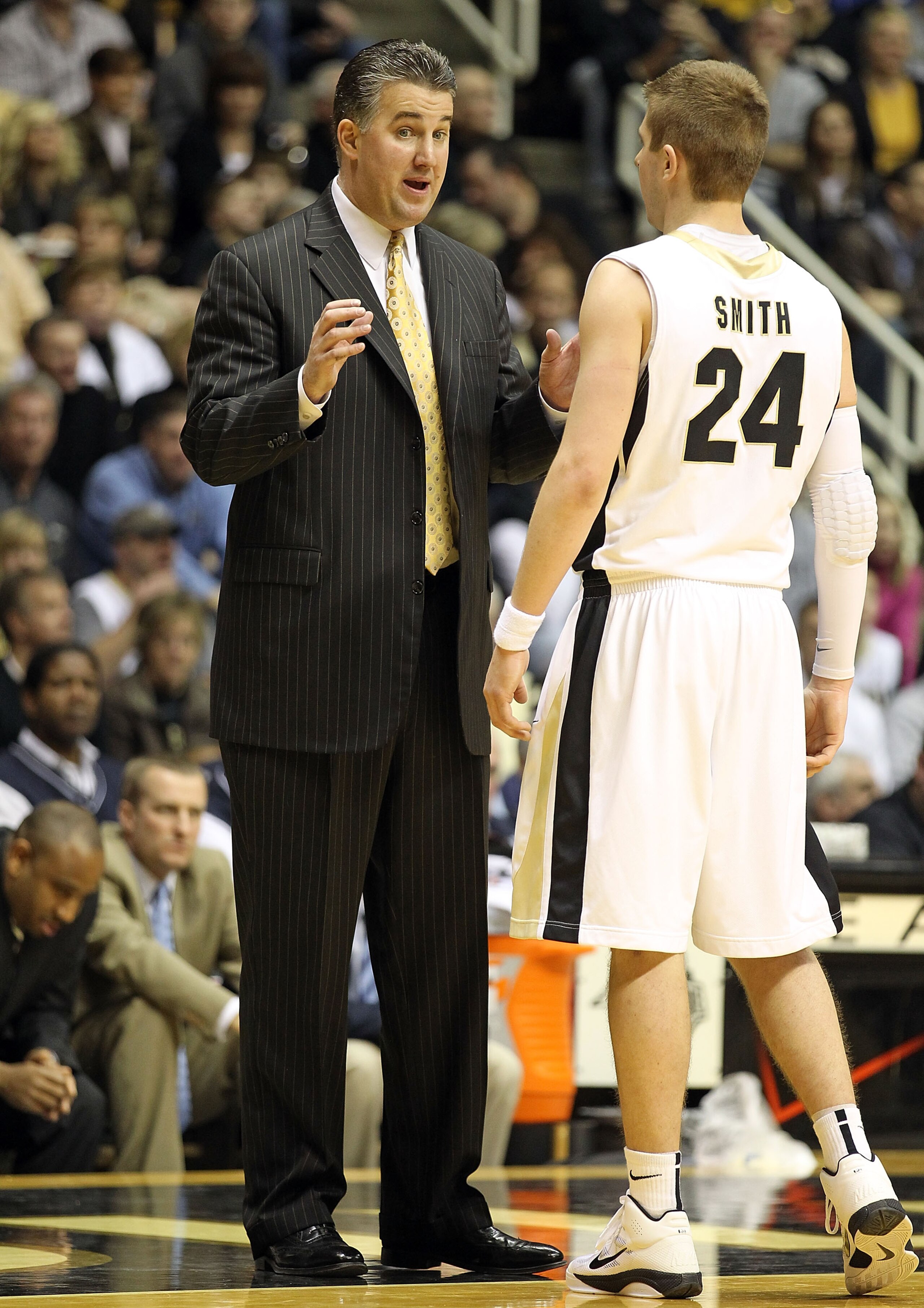 WEST LAFAYETTE, IN - JANUARY 09:  Matt Painter the Head Coach of the Purdue Boilermakers gives instructions to Ryne Smith #24 during the Big Ten Conference game against the Iowa Hawkeyes at Mackey Arena on January 9, 2011 in West Lafayette, Indiana.  Purd