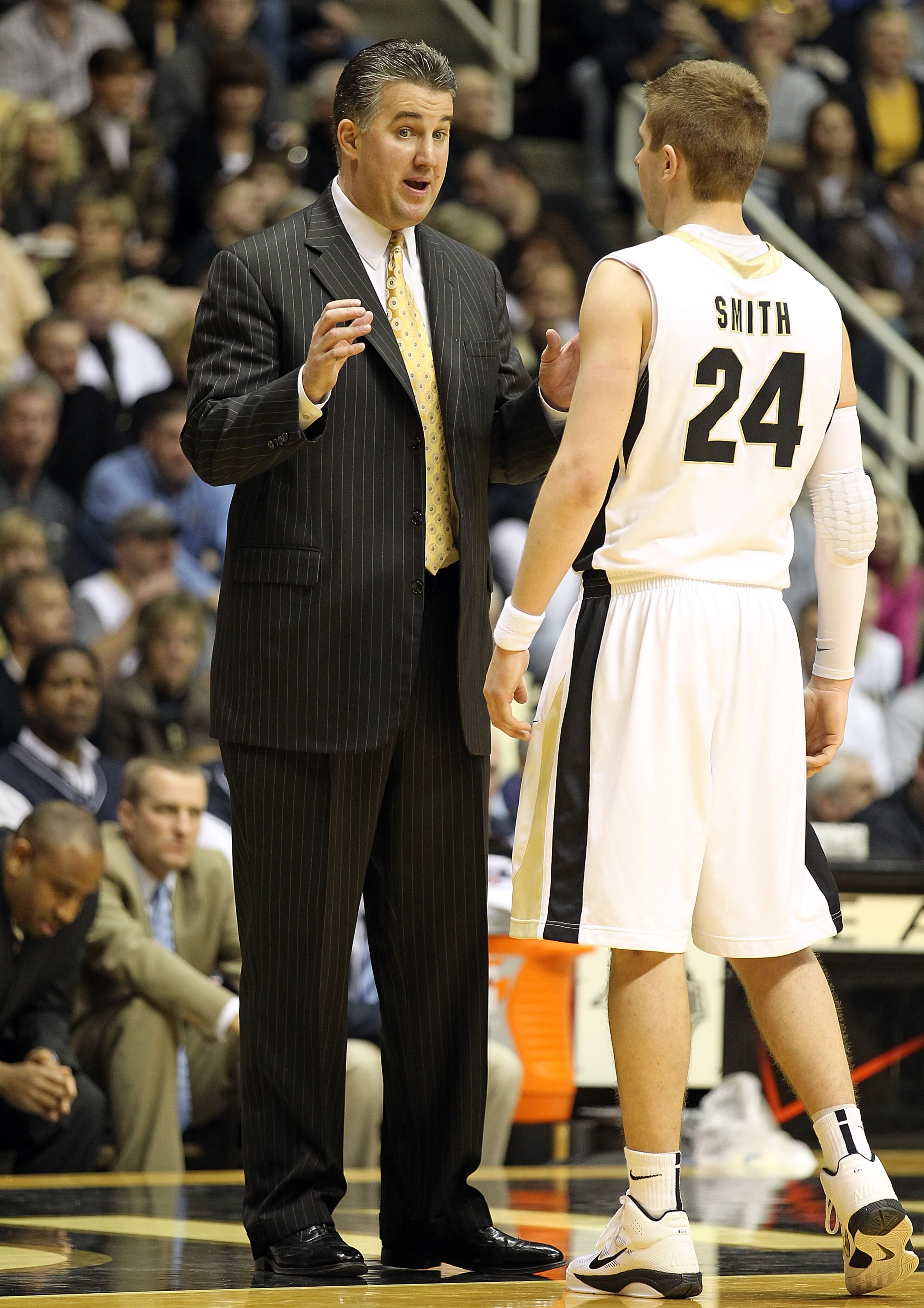 WEST LAFAYETTE, IN - JANUARY 09:  Matt Painter the Head Coach of the Purdue Boilermakers gives instructions to Ryne Smith #24 during the Big Ten Conference game against the Iowa Hawkeyes at Mackey Arena on January 9, 2011 in West Lafayette, Indiana.  Purd