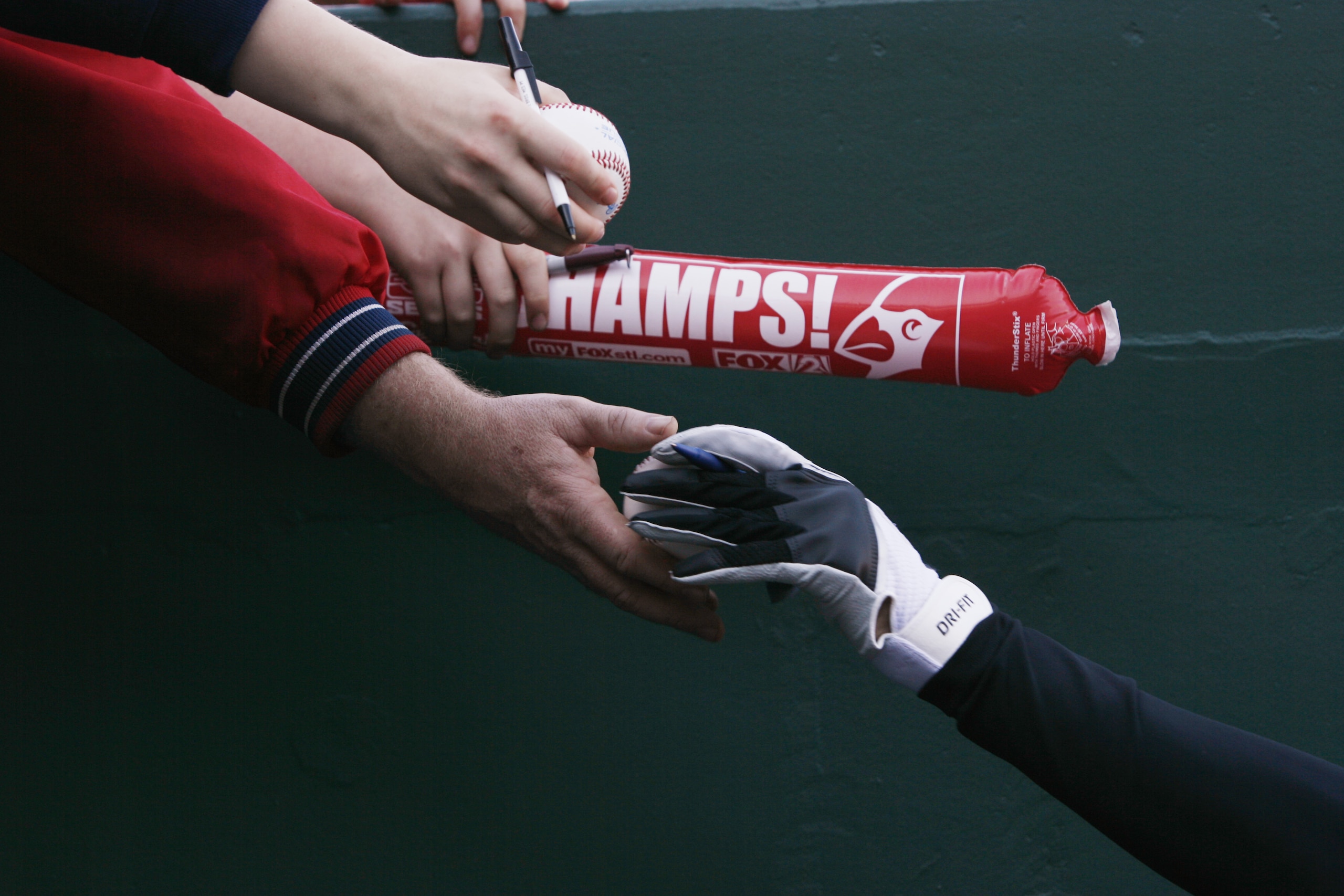 ST. LOUIS - APRIL 1:  A detail view shows a player autographing baseballs for fans before the St. Louis Cardinals game against the New York Mets during their Opening Day game on April 1, 2007 at Busch Stadium in St. Louis, Missouri.  The Mets beat the Car
