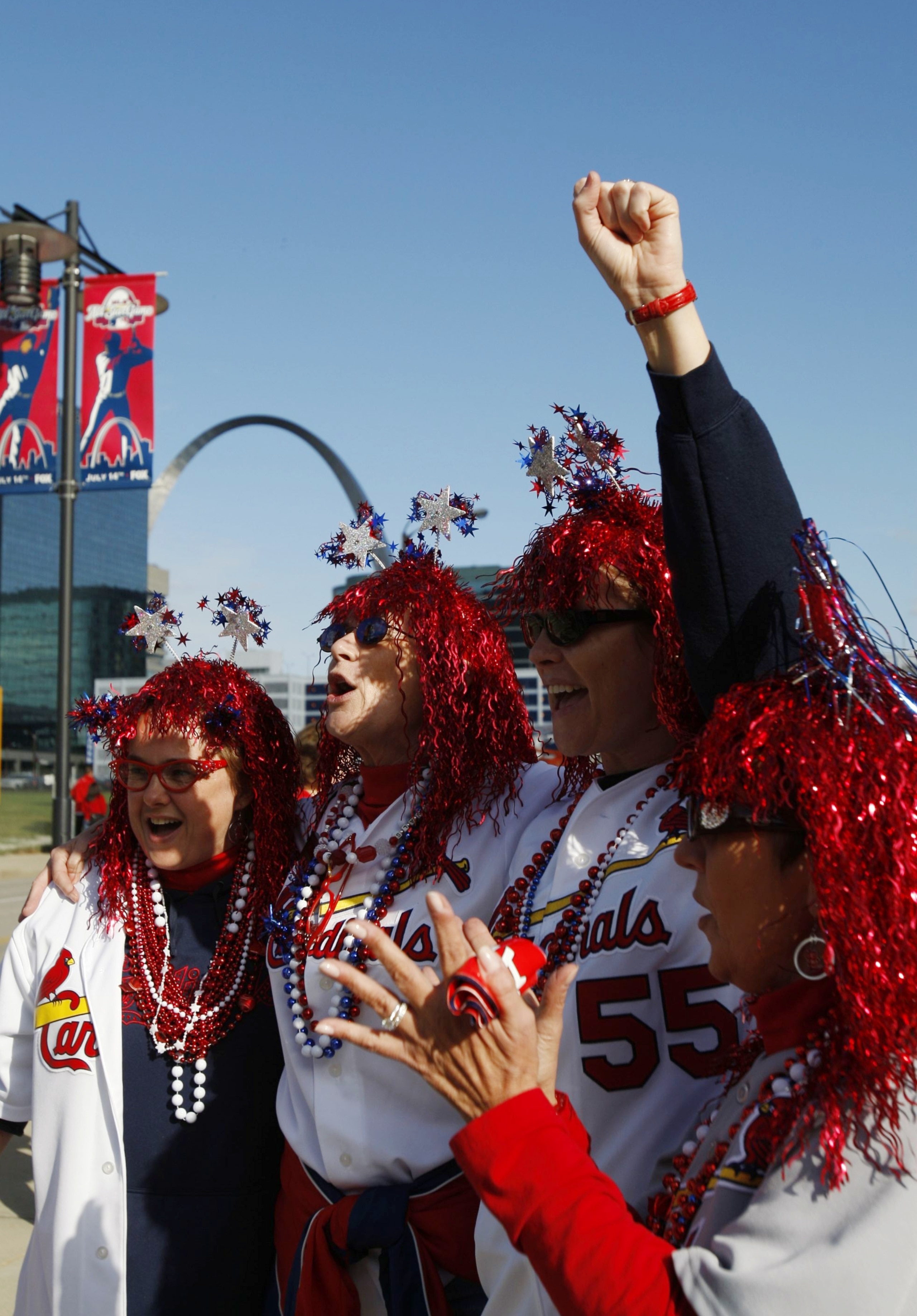 ST. LOUIS, MO - OCTOBER 10:  Fans of the St. Louis Cardinals cheer for their team before the start of Game Three of the NLDS during the 2009 MLB Playoffs against of the Los Angeles Dodgers at Busch Stadium on October 10, 2009 in St. Louis, Missouri. (Phot