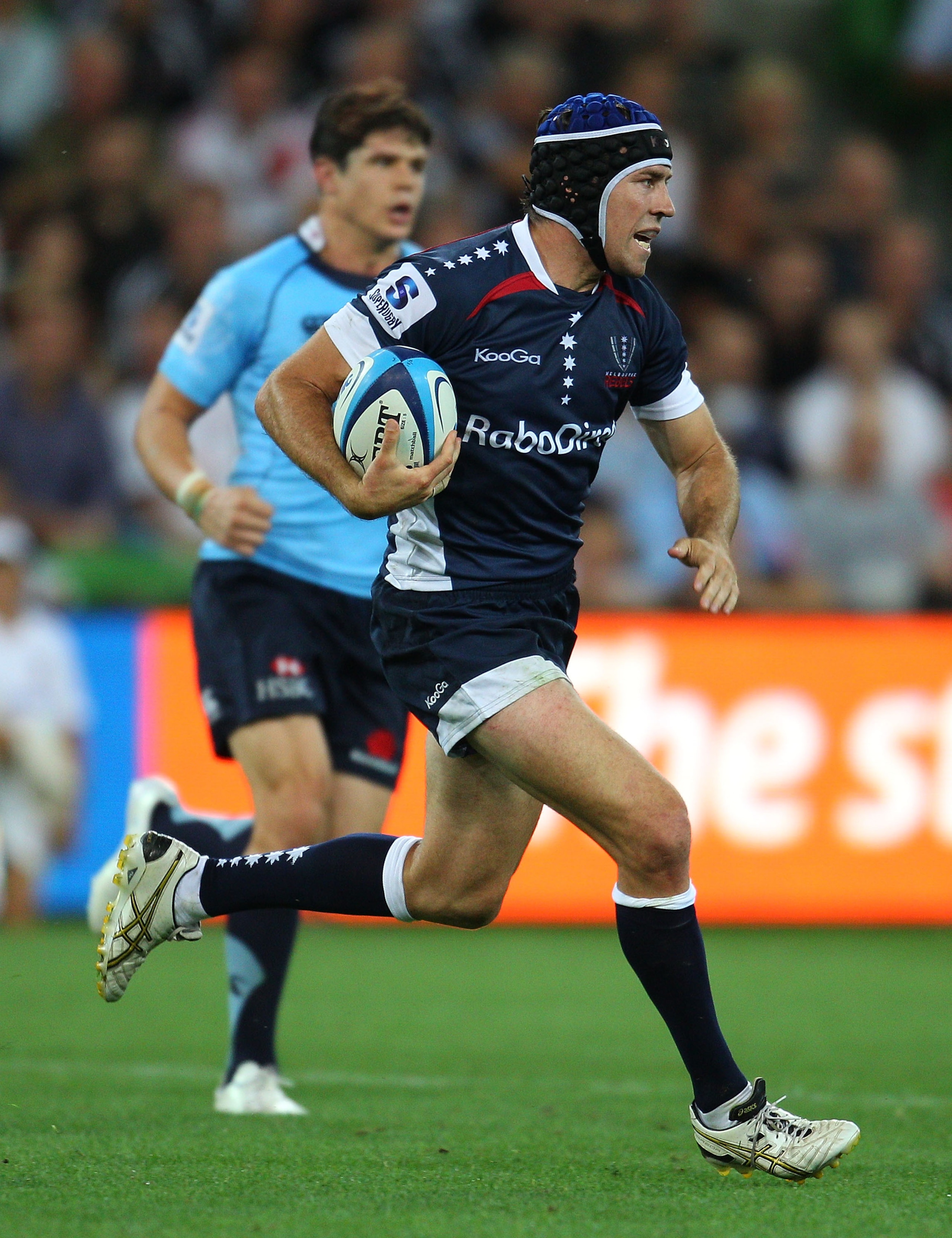 MELBOURNE, AUSTRALIA - FEBRUARY 18:  Julian Huxley of the Rebels runs with the ball during the round one Super Rugby match between the Melbourne Rebels and the Waratahs at AAMI Park on February 18, 2011 in Melbourne, Australia.  (Photo by Scott Barbour/Ge