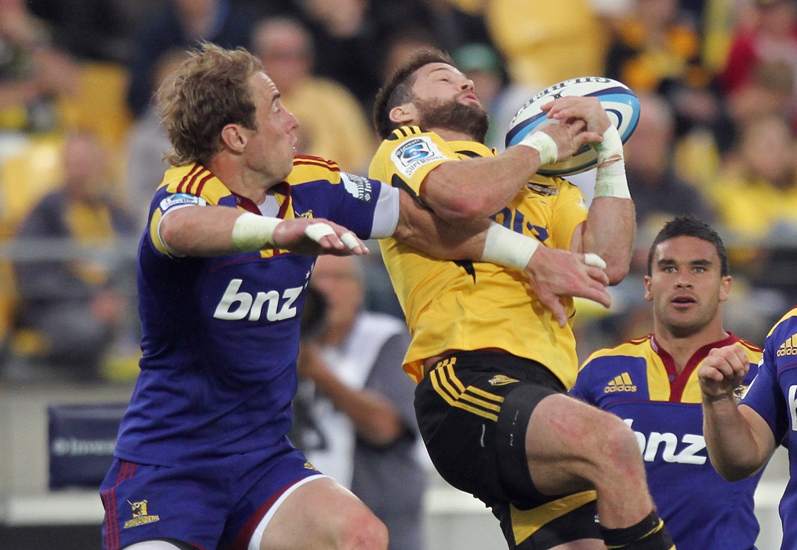 WELLINGTON, NEW ZEALAND - FEBRUARY 18:  Cory Jane of the Hurricanes and Jimmy Cowan of the Highlanders jump for the ball during the round one Super Rugby match between the Hurricanes and the Highlanders at Westpac Stadium on February 18, 2011 in Wellingto