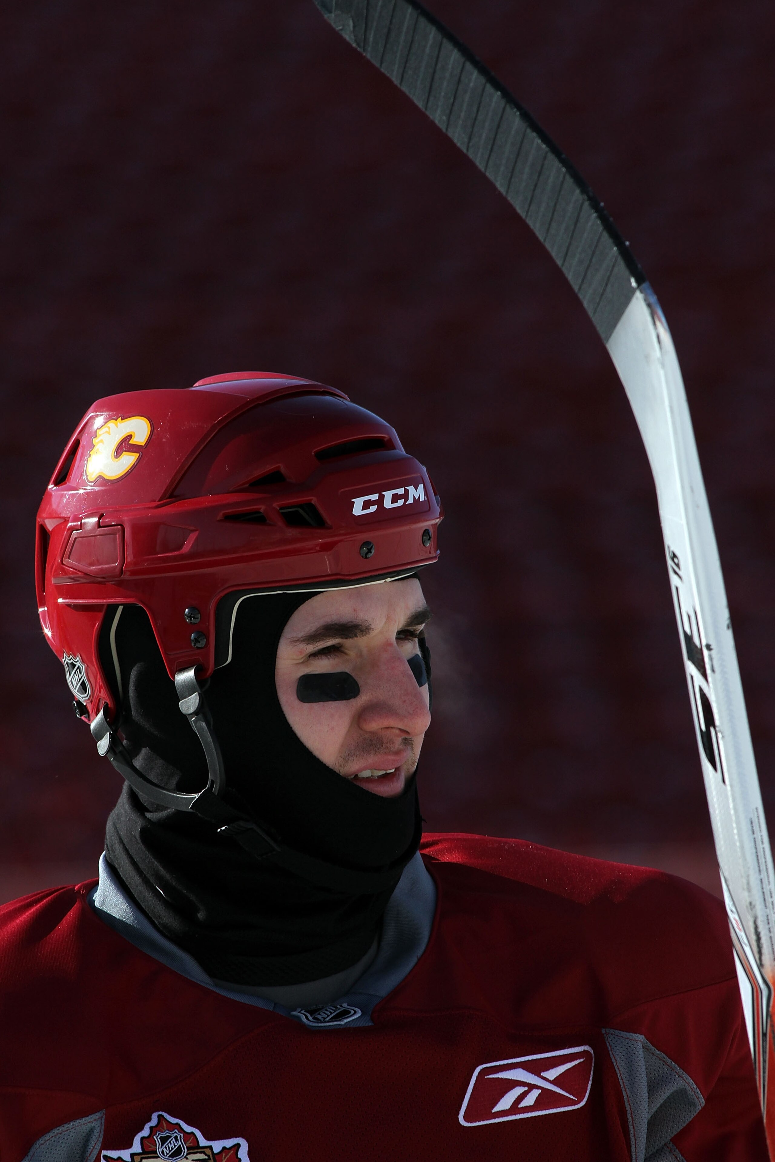 CALGARY, AB - FEBRUARY 19: Curtis Glencross #20 of the Calgary Flames takes a break during the practice session the day before the 2011 NHL Heritage Classic at McMahon Stadium on February 19, 2011 in Calgary, Canada.  (Photo by Andre Ringuette/Getty Image
