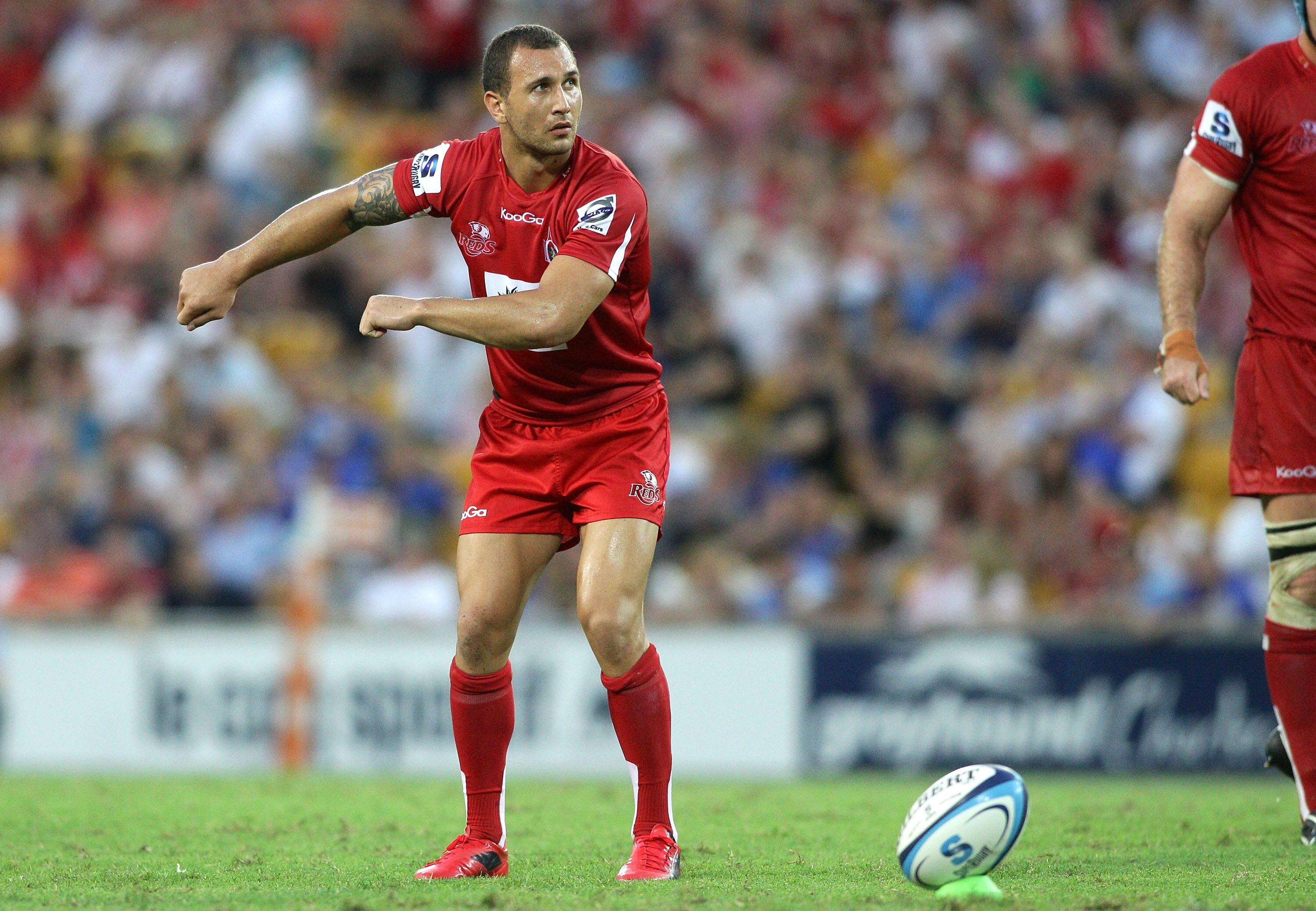 BRISBANE, AUSTRALIA - FEBRUARY 20: Quade Cooper of the Reds lines up a kick for goal during the round one Super Rugby match between the Reds and the Western Force at Suncorp Stadium on February 20, 2011 in Brisbane, Australia.  (Photo by Bradley Kanaris/G